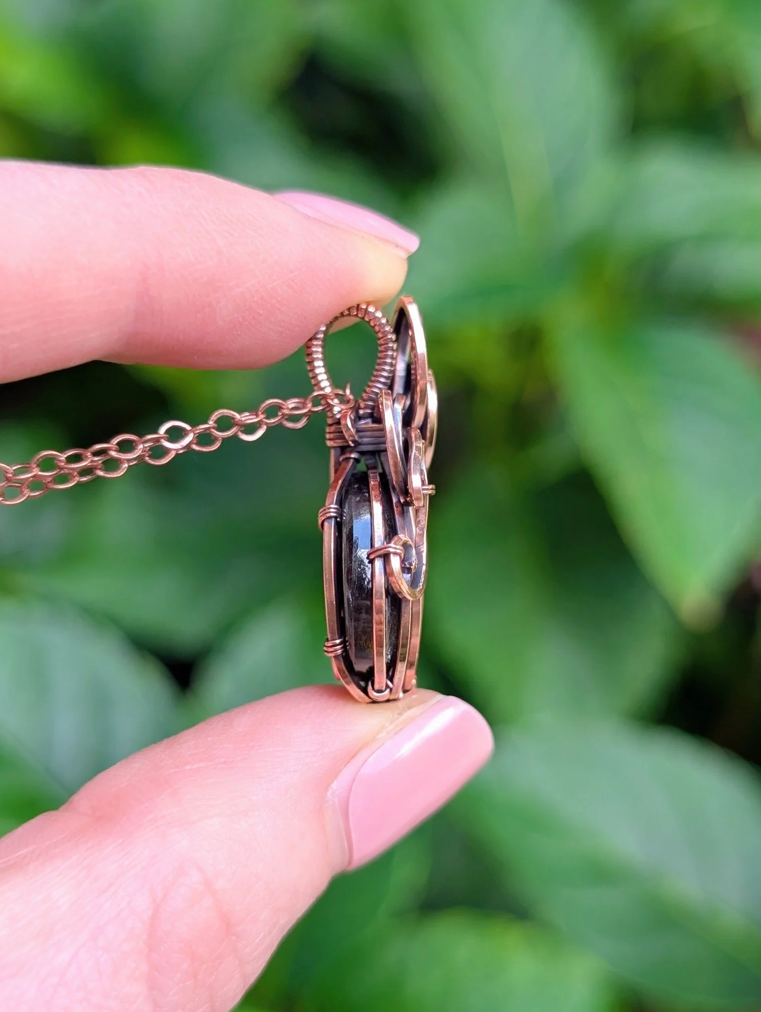side of The Pumpkin Necklace with Orange & Purple Labradorite in Copper