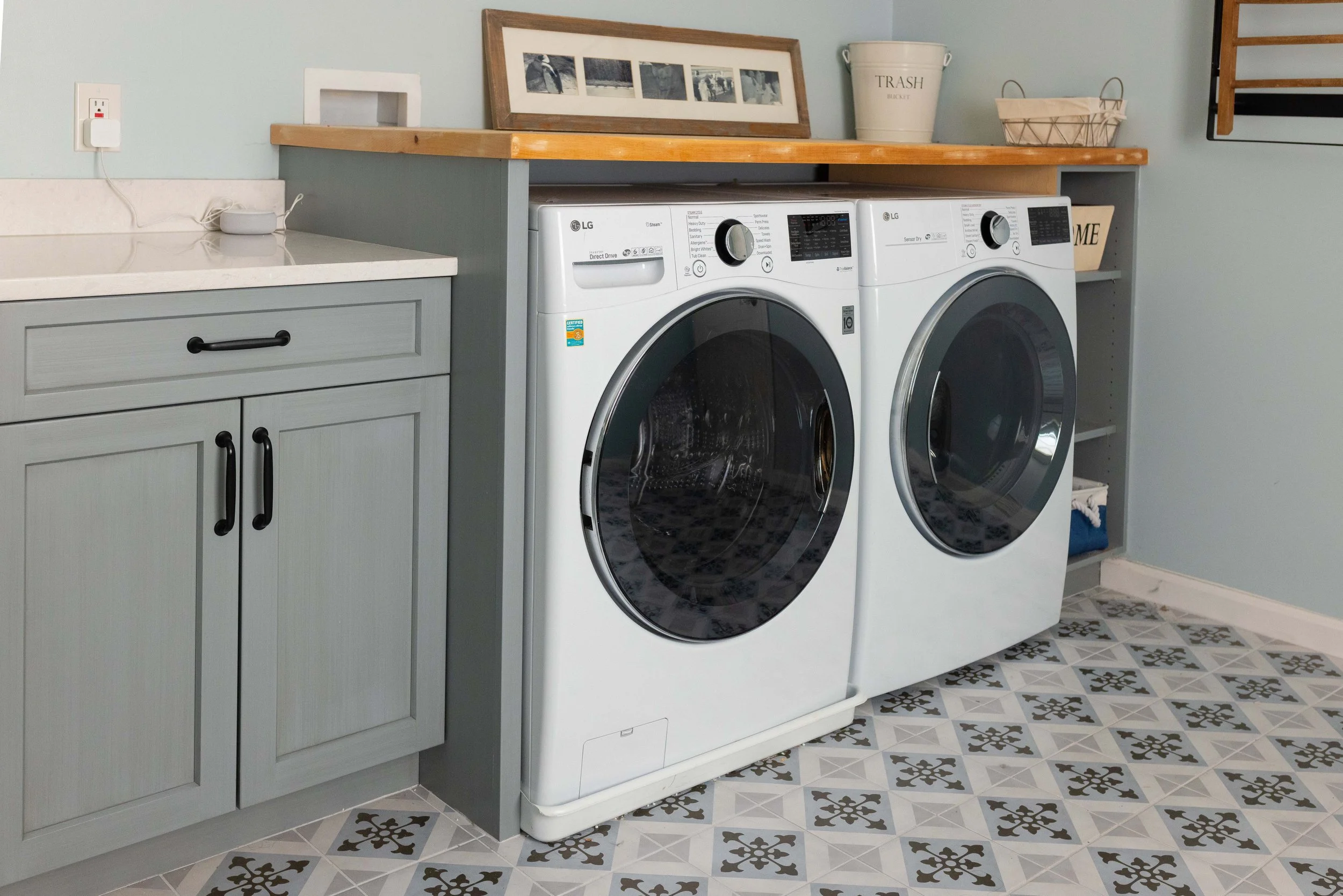 A washer and dryer in a remodeled laundry room.