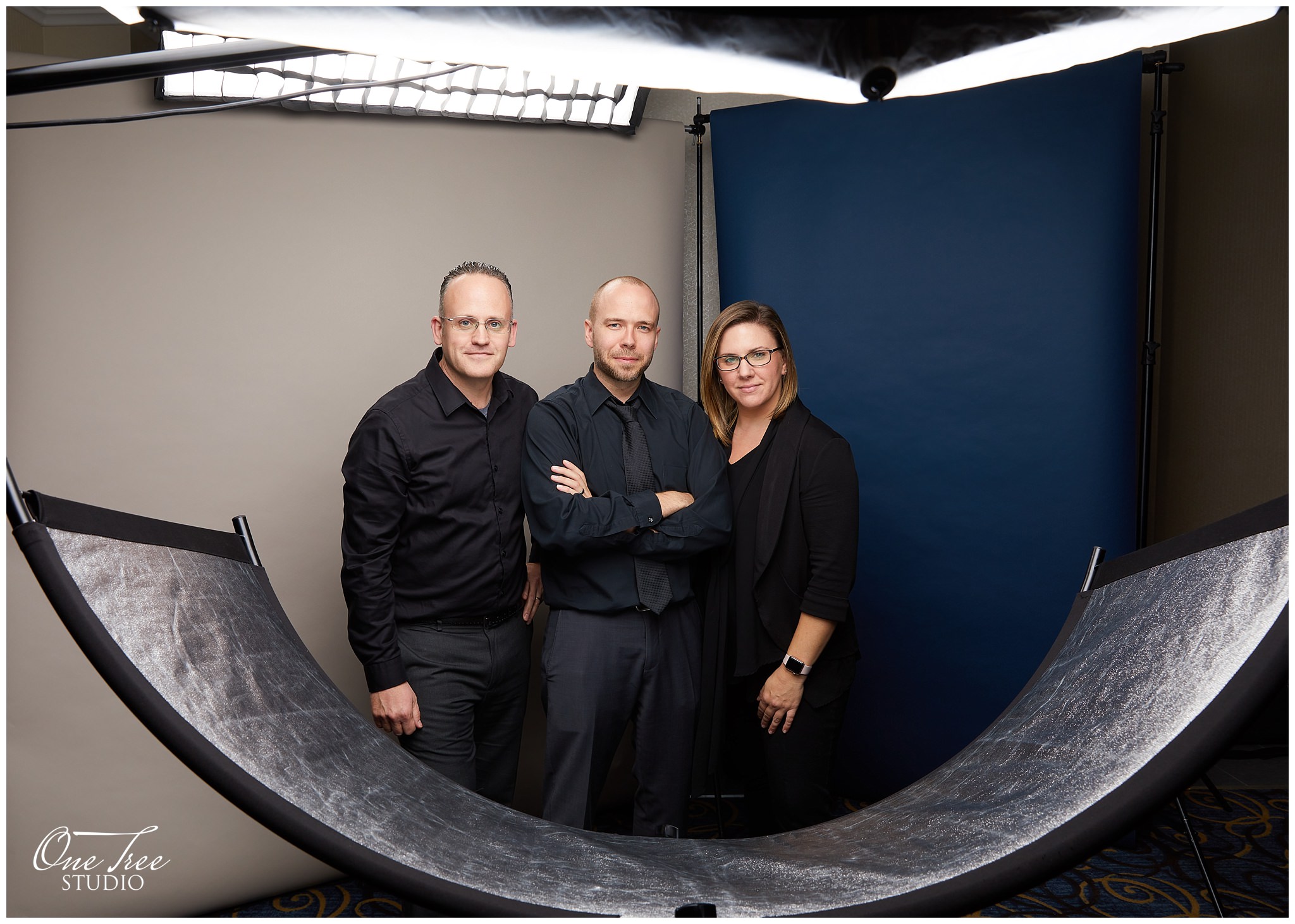 A double backdrop setup with Suede Grey and Ultramarine. AND three of our amazing team members!