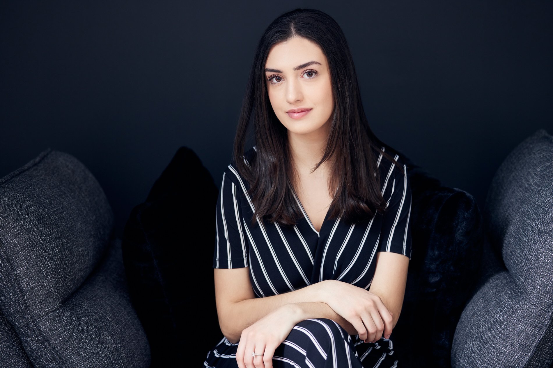 Modern branding headshot of Hannah wearing a dark outfit during a professional portrait session.