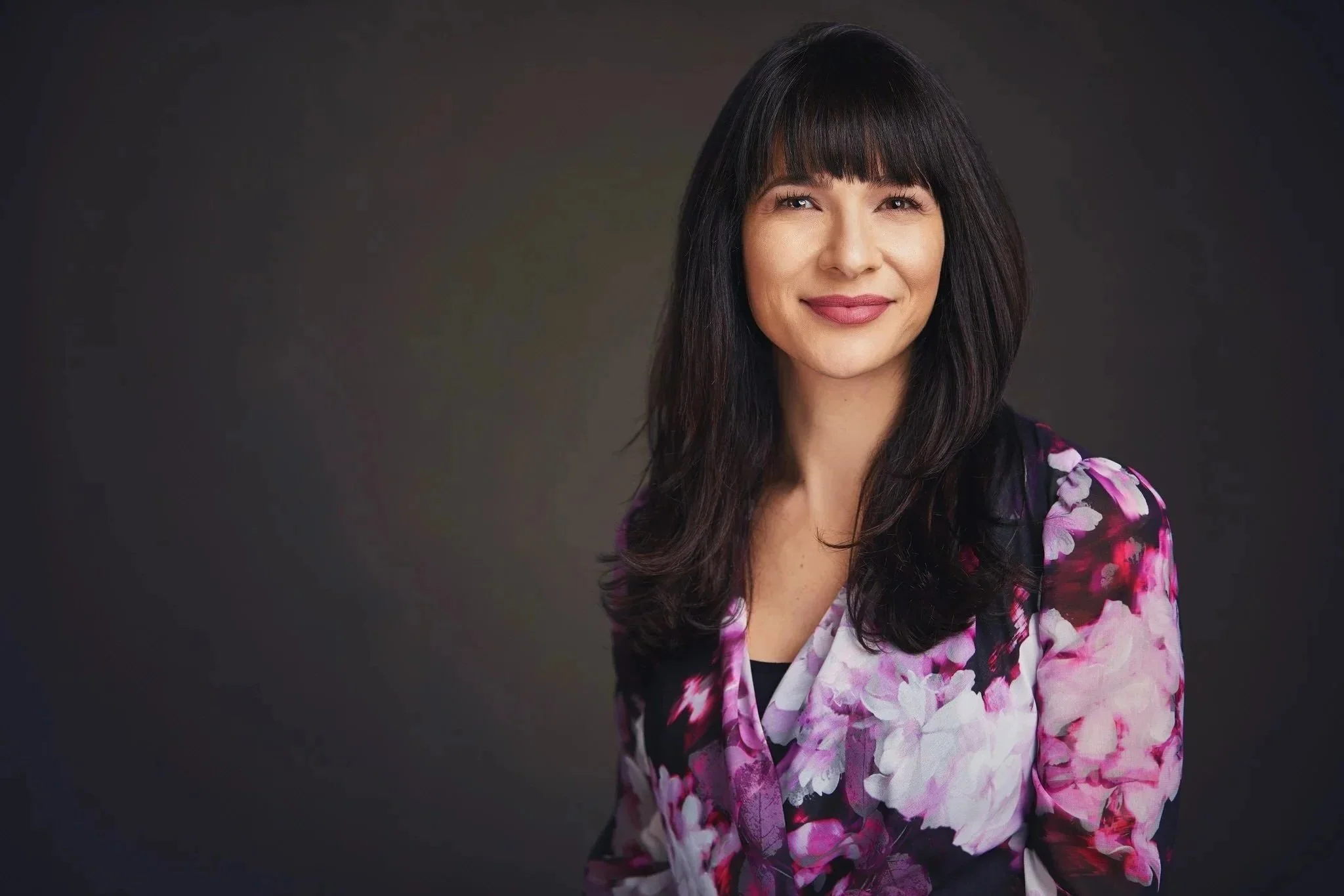 Professional corporate headshot of a woman photographed by One Tree Studio