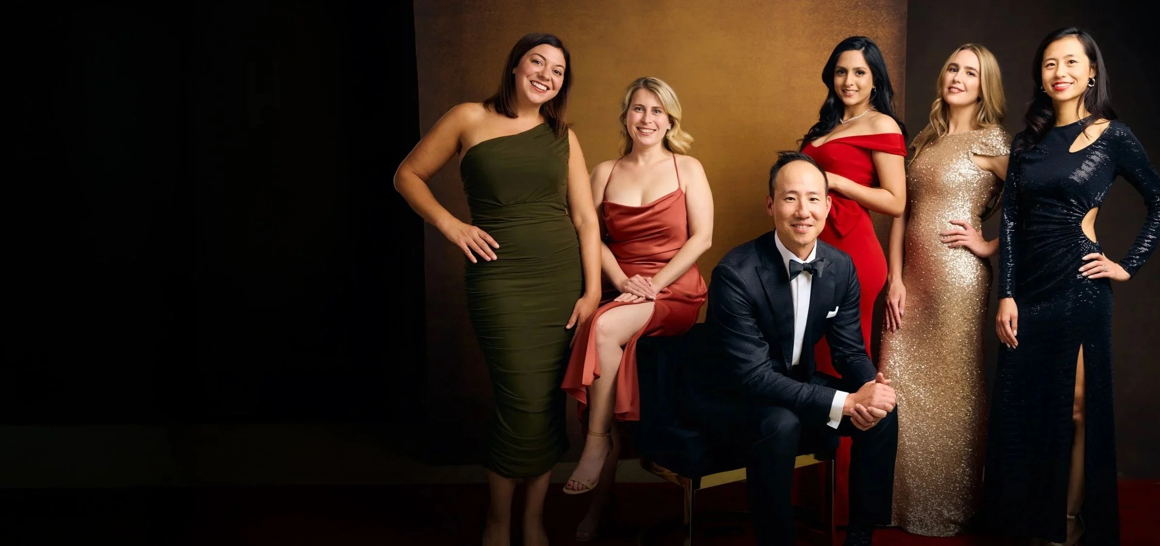 Guests photographed with professional studio lighting at a luxury gala
