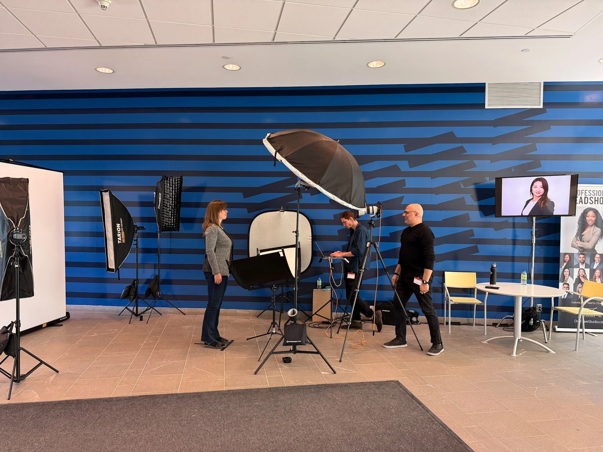 Professional headshots being taken of a female employee at IBM Canada Head Office.