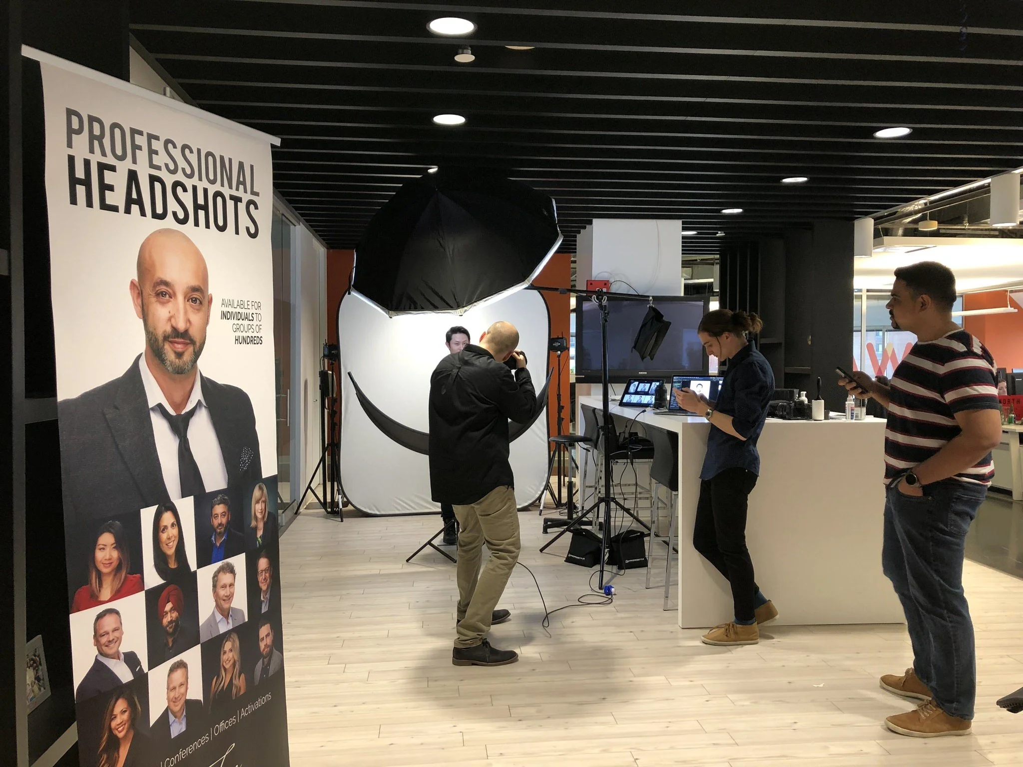 One Tree Studio team setting up professional headshots at a client location