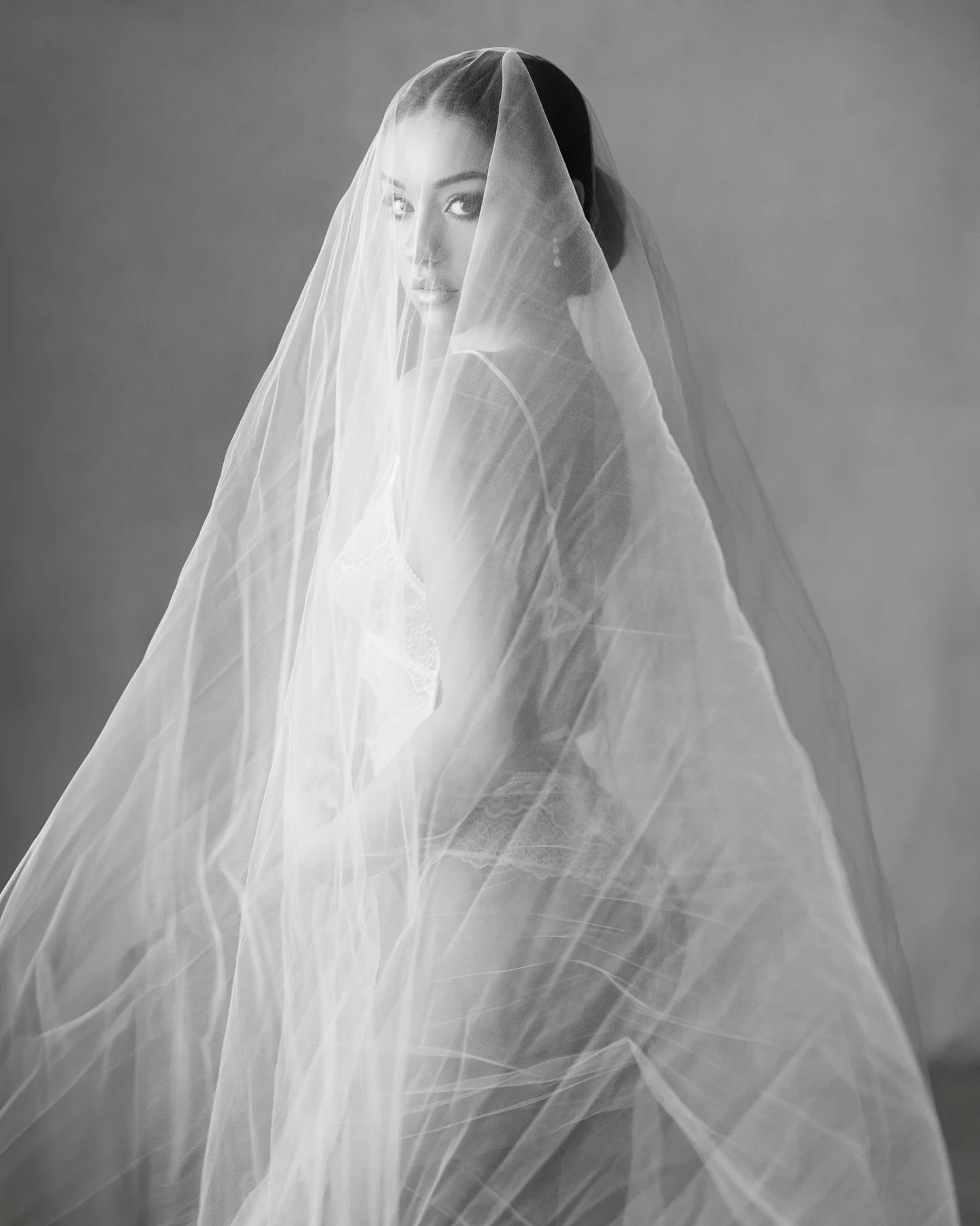 Veiled in softness, strength, and quiet beauty.
A timeless bridal portrait that celebrates intimacy and grace. Bride @margaritaamarie Makeup &amp; Hair @makeup_by_gerta 
#bridalboudroir #bridalportrait #nycweddingphotographer #njweddingphotographer #