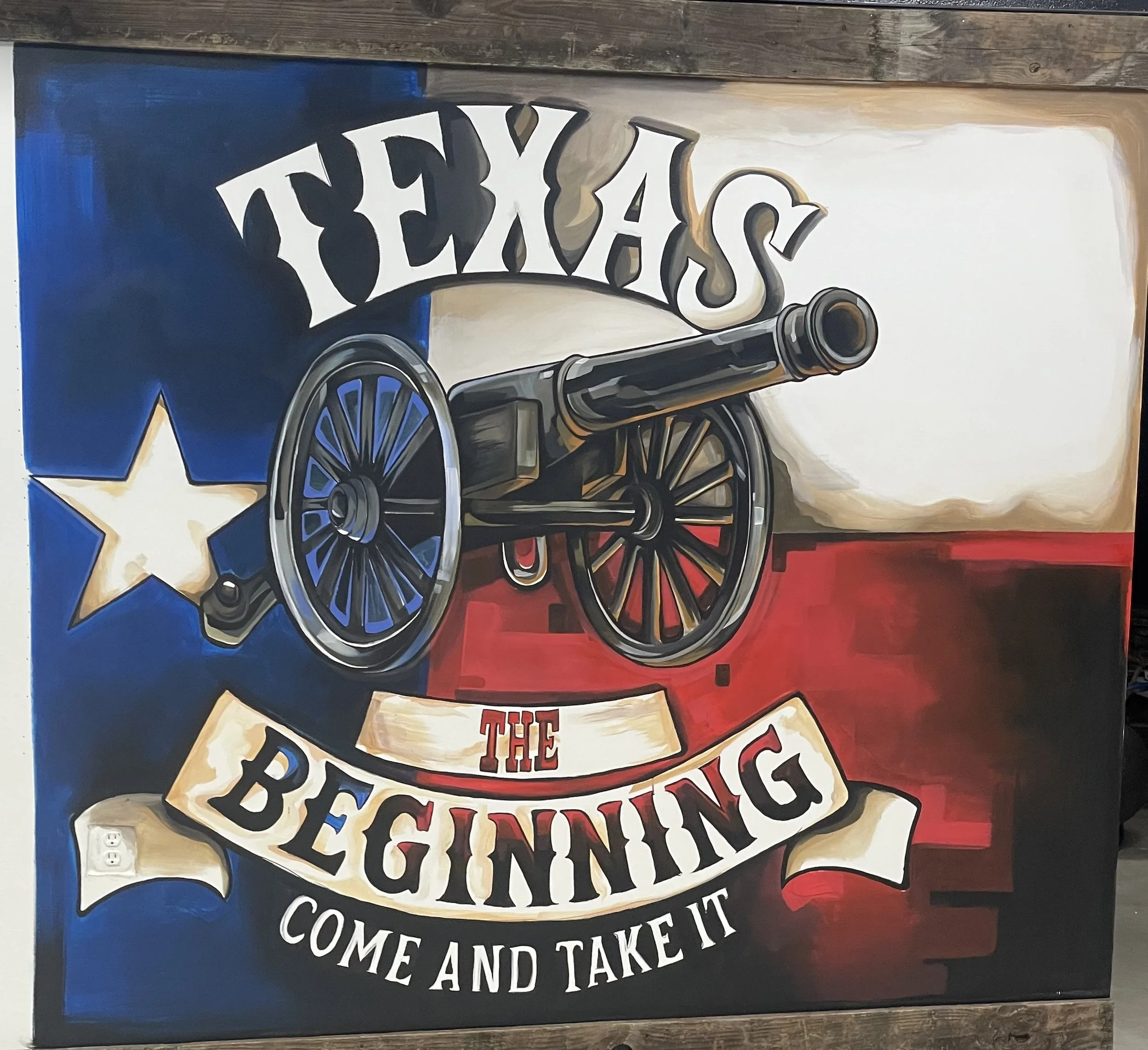 A painting with a cannon in front of a background with the Texas state flag, featuring a lone star, red, white, and blue colors. The text reads, 'Texas the Beginning, Come and Take It.'