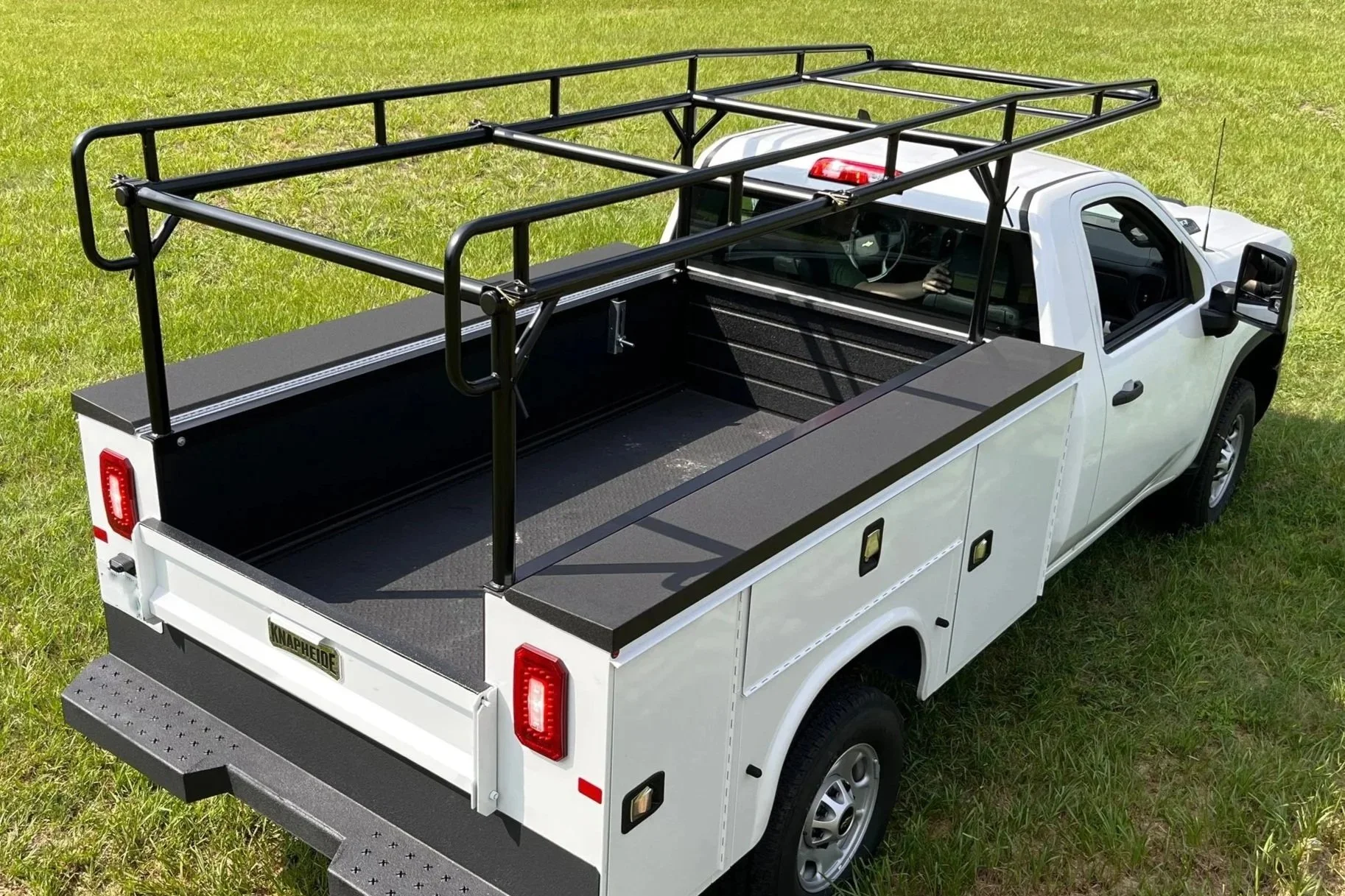 Sterling Truck Rack on a service body in a field of grass