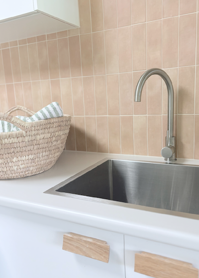 image of laundry sink with terracotta look tiles