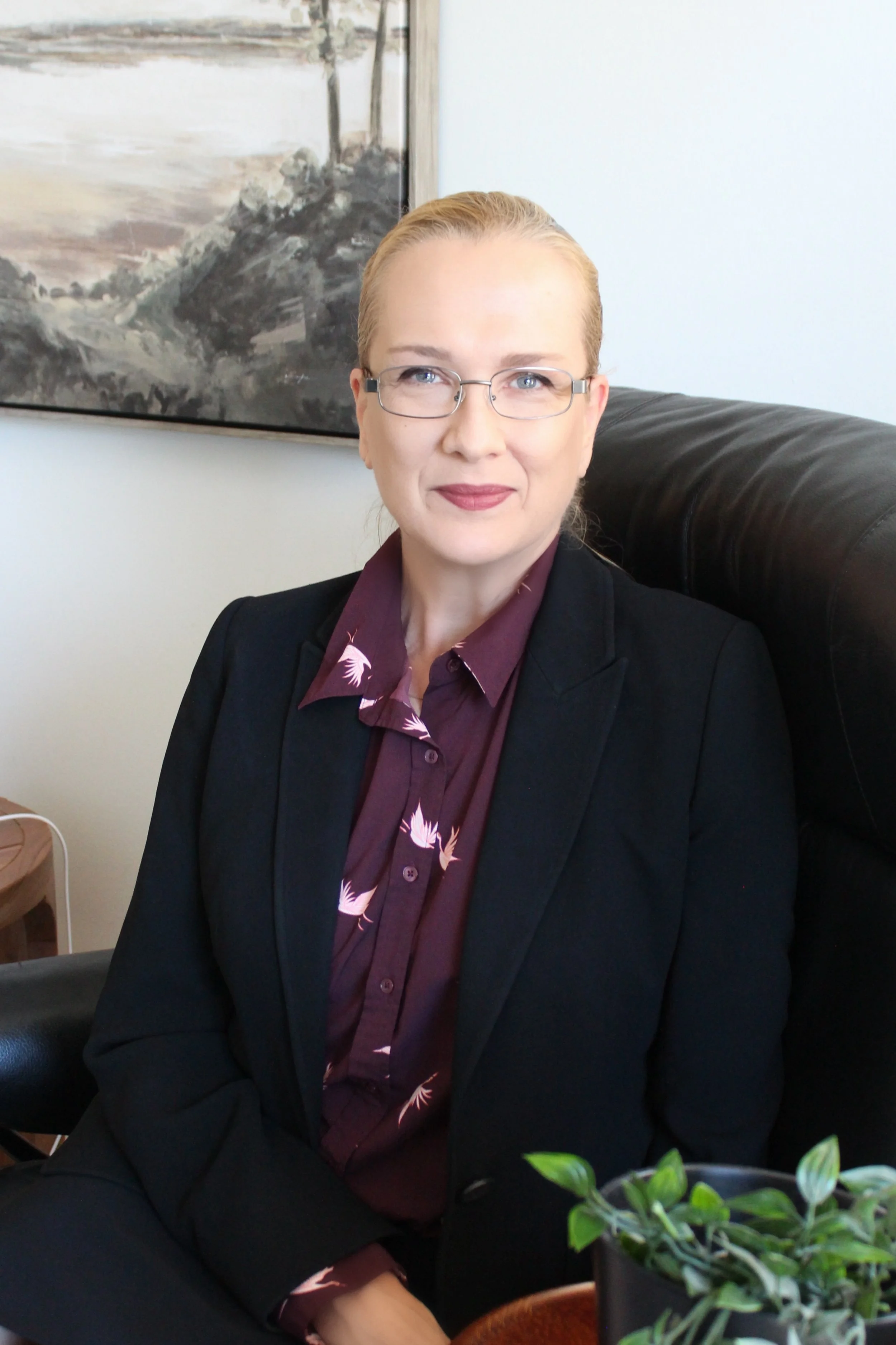 nice woman sitting with black jacket on smiling