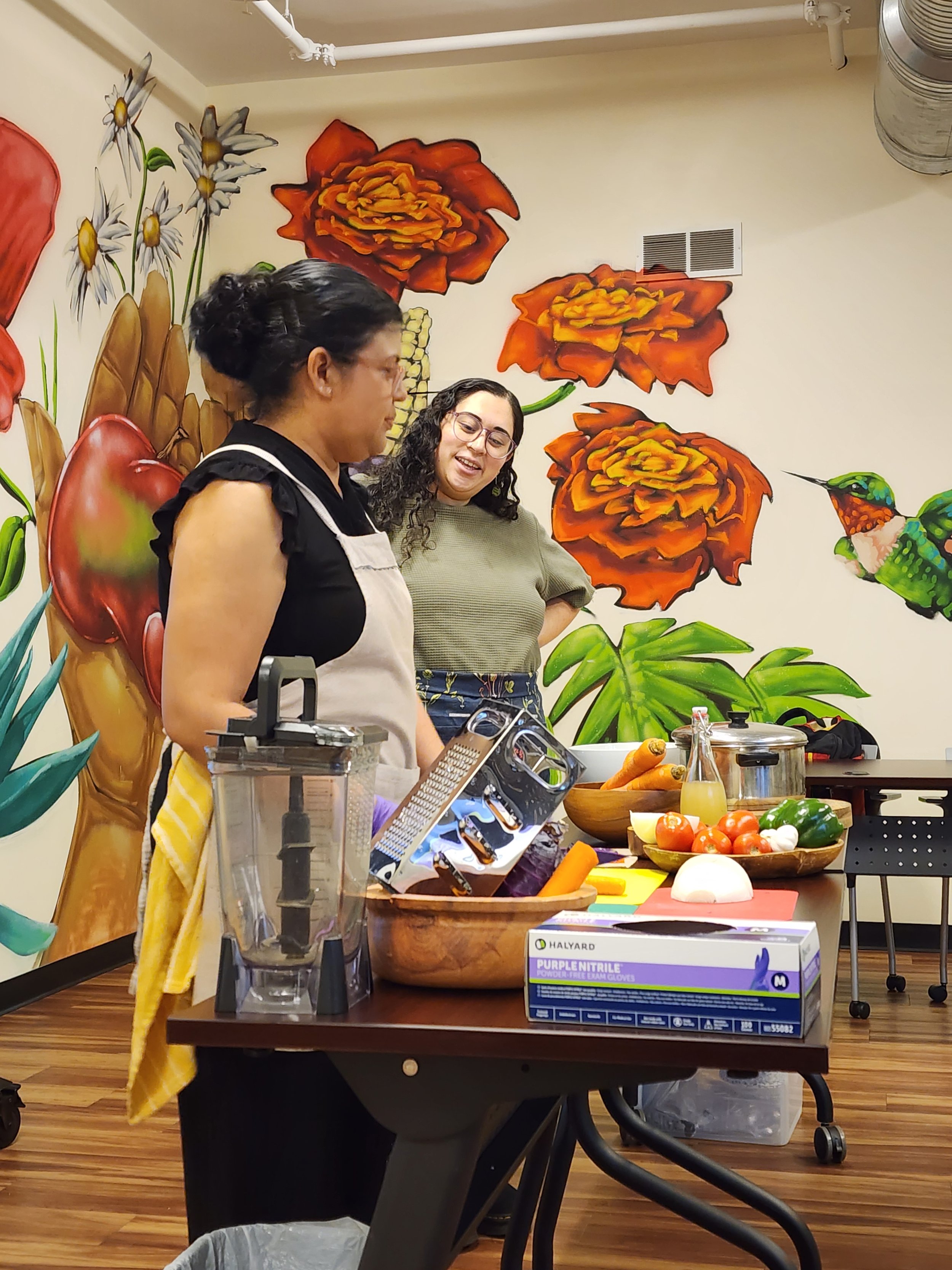 Two people leading a cooking class.