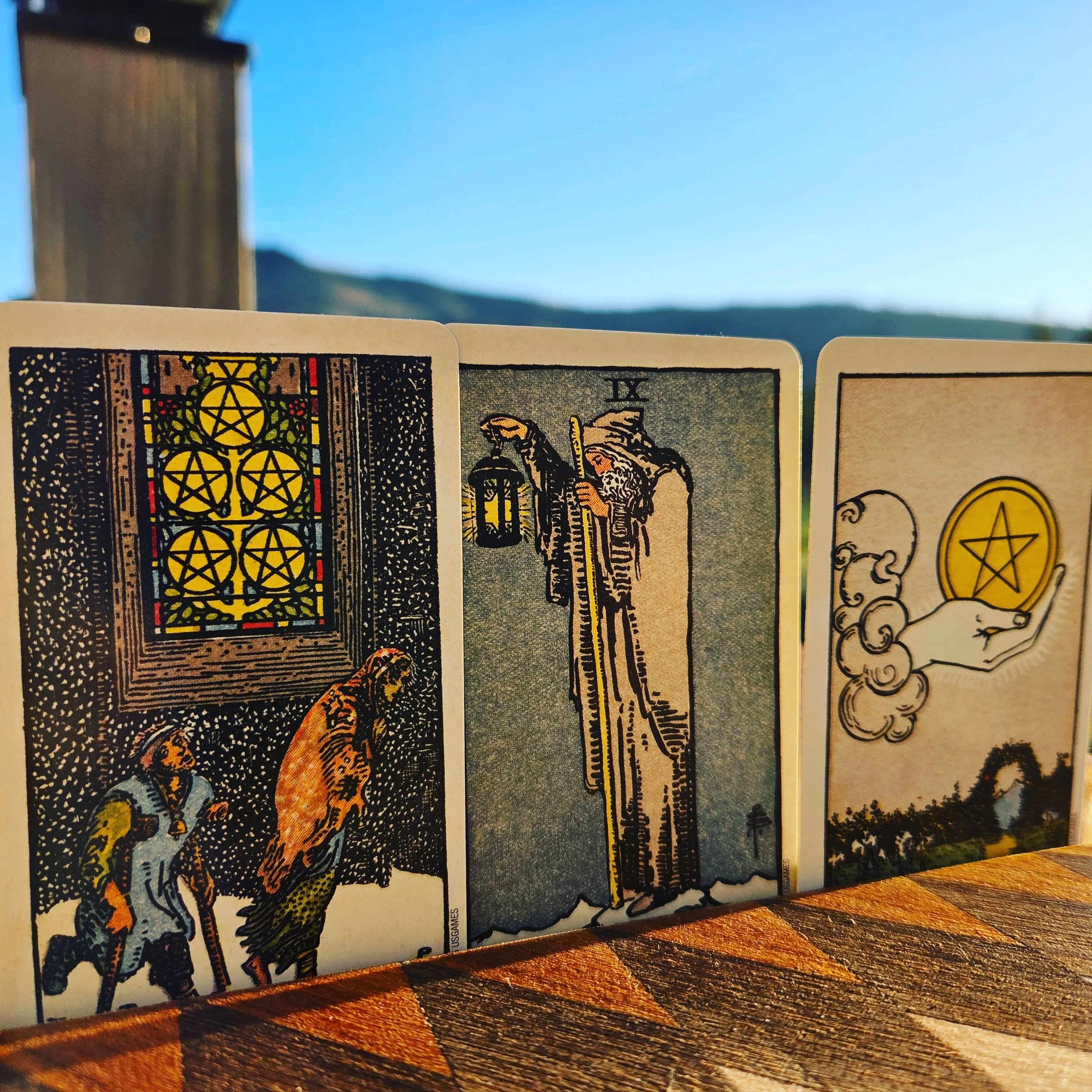 A SPREAD FOR UNCERTAIN TIMES

Query: "What should I keep in mind as we move into this economically uncertain time?"

The Fog &amp; The Road &mdash; three cards, one honest look.

─────────────────────────────────────

LET GO &mdash; Five of