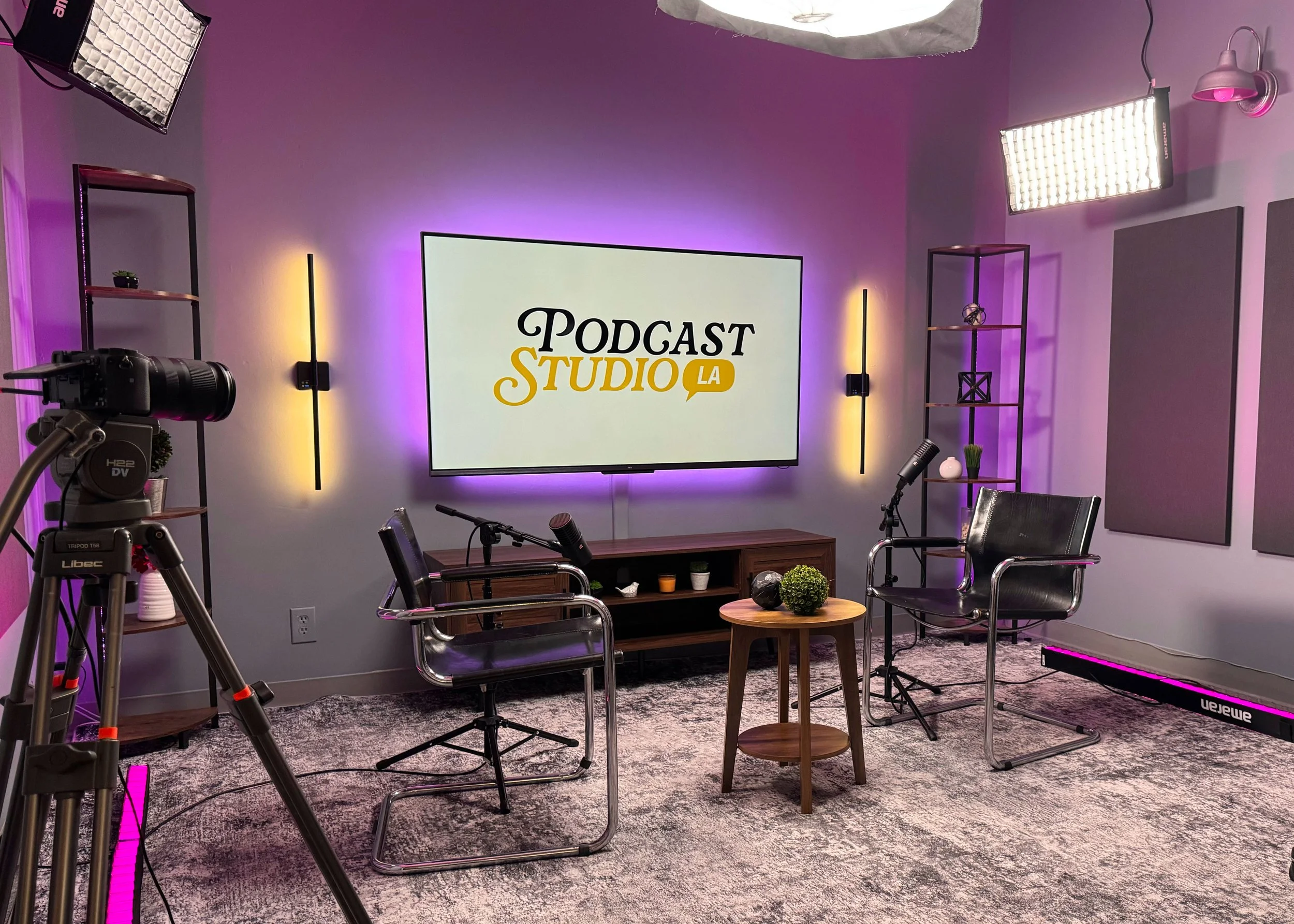 65-inch in-studio TV displaying podcast logo branding