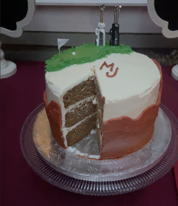 Moist gluten-free carrot cake with cream cheese frosting on a cake stand