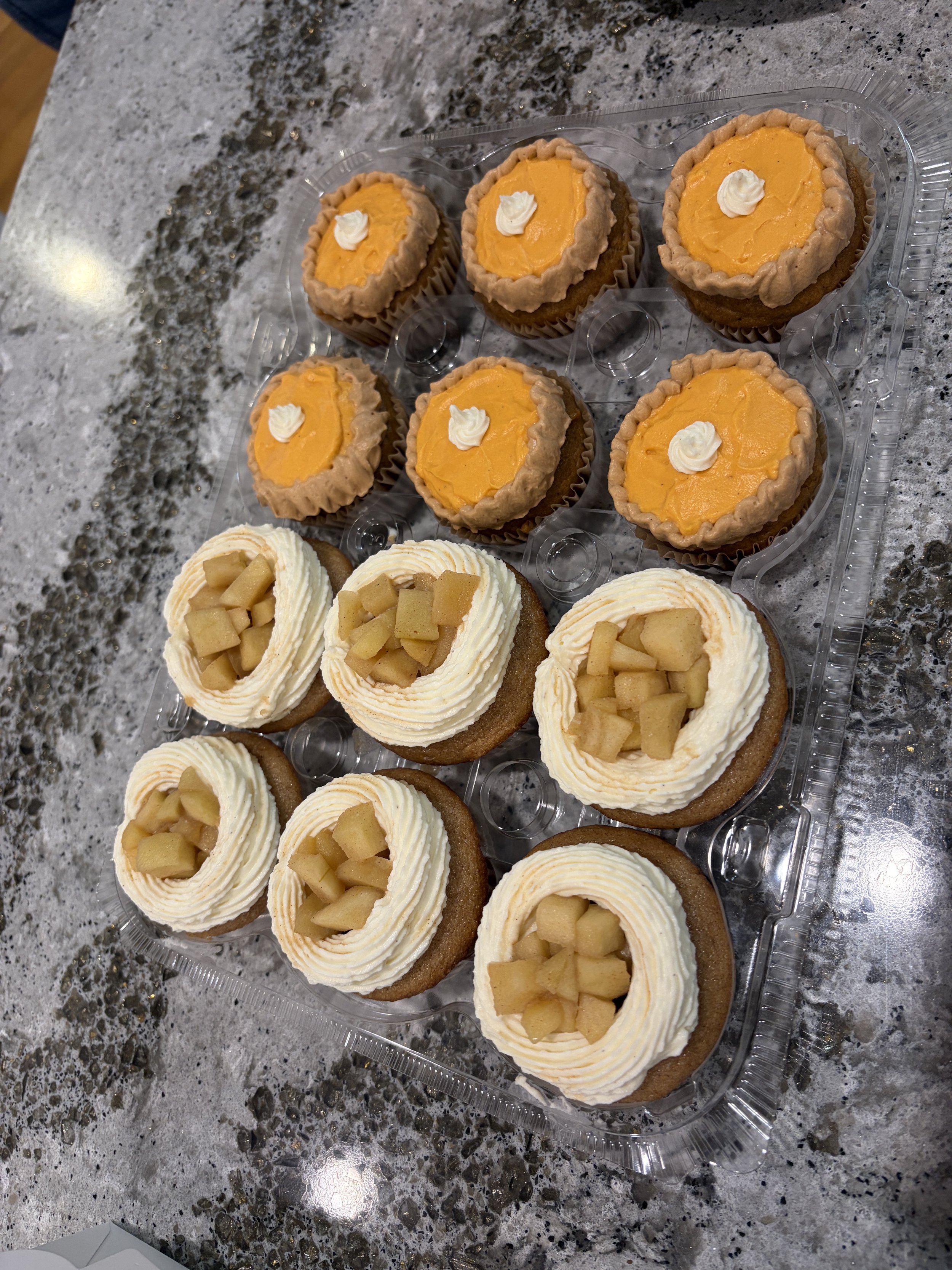 6 Apple Pie cupcakes and 6 Pumpkin Pie cupcakes.