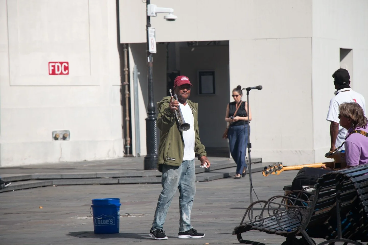 Bearer: One that bears.

&mdash;&mdash;

Bearers 010 - Musician.
Jackson Square.  New Orleans, Louisiana
