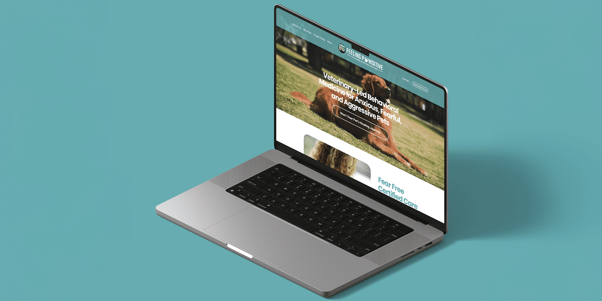A laptop displaying a website with a photo of a dog lying on grass. The website content is about veterinary behavior medicine for pets.