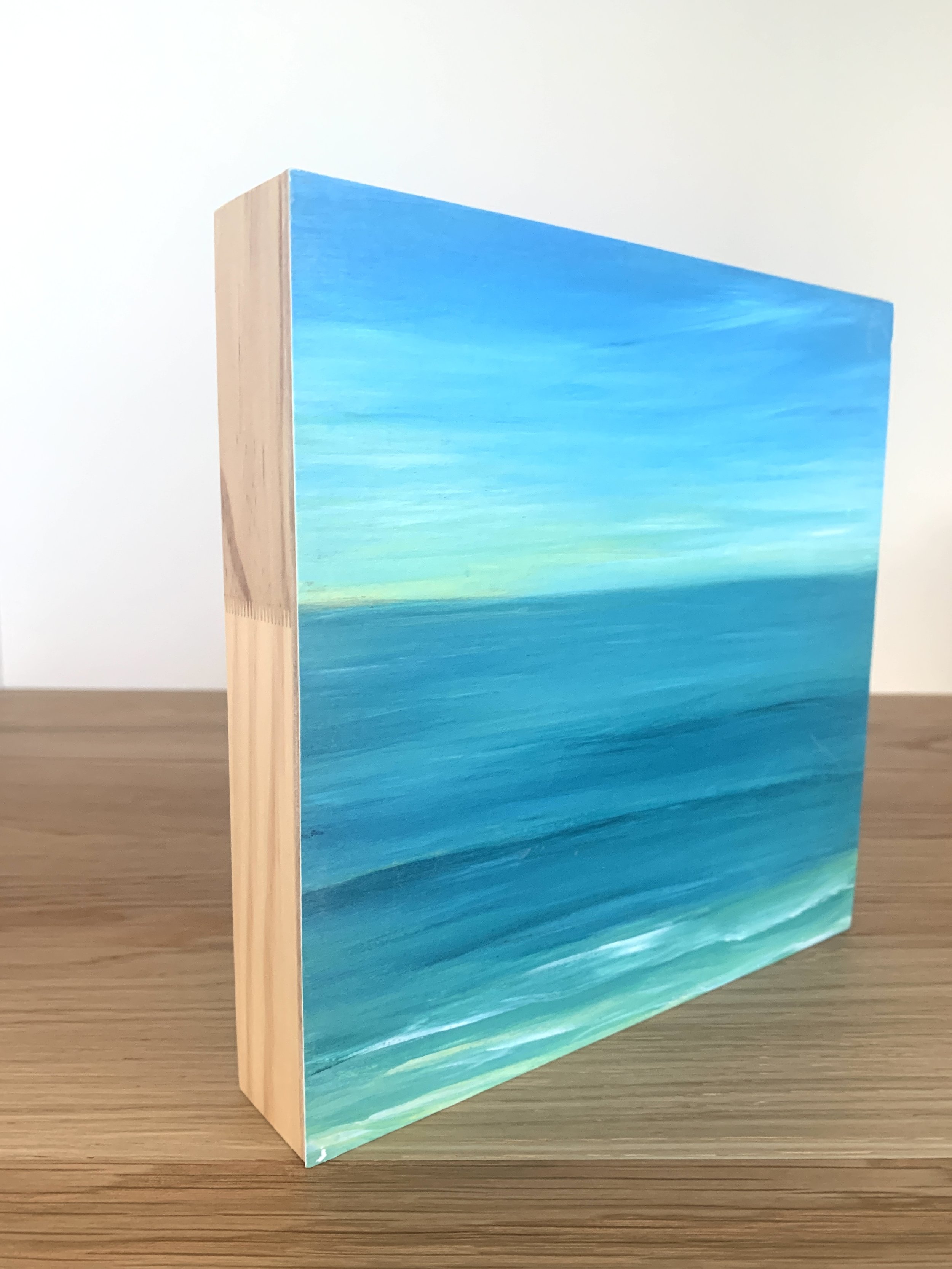 Calm Ocean by Lynette Tyrrell pring on wood panel side view.jpg