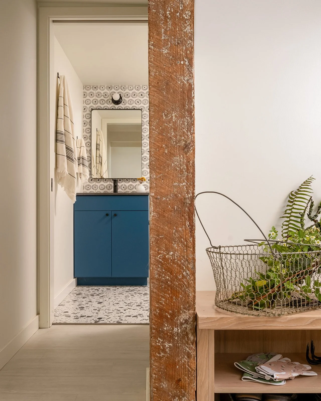 View of a bathroom through a dividing wall. Seattle, Queen Anne, Basement, Remodel.