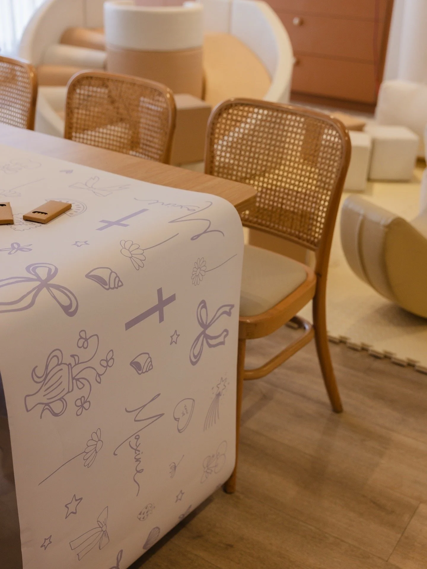 Custom illustrated table runner and event stationery designed for a celebration, featuring hand-drawn artwork and bespoke event branding.