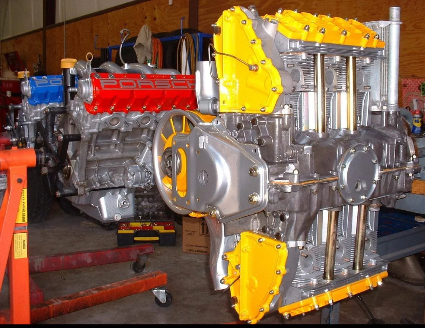 Porsche engines with colorful details in a workshop