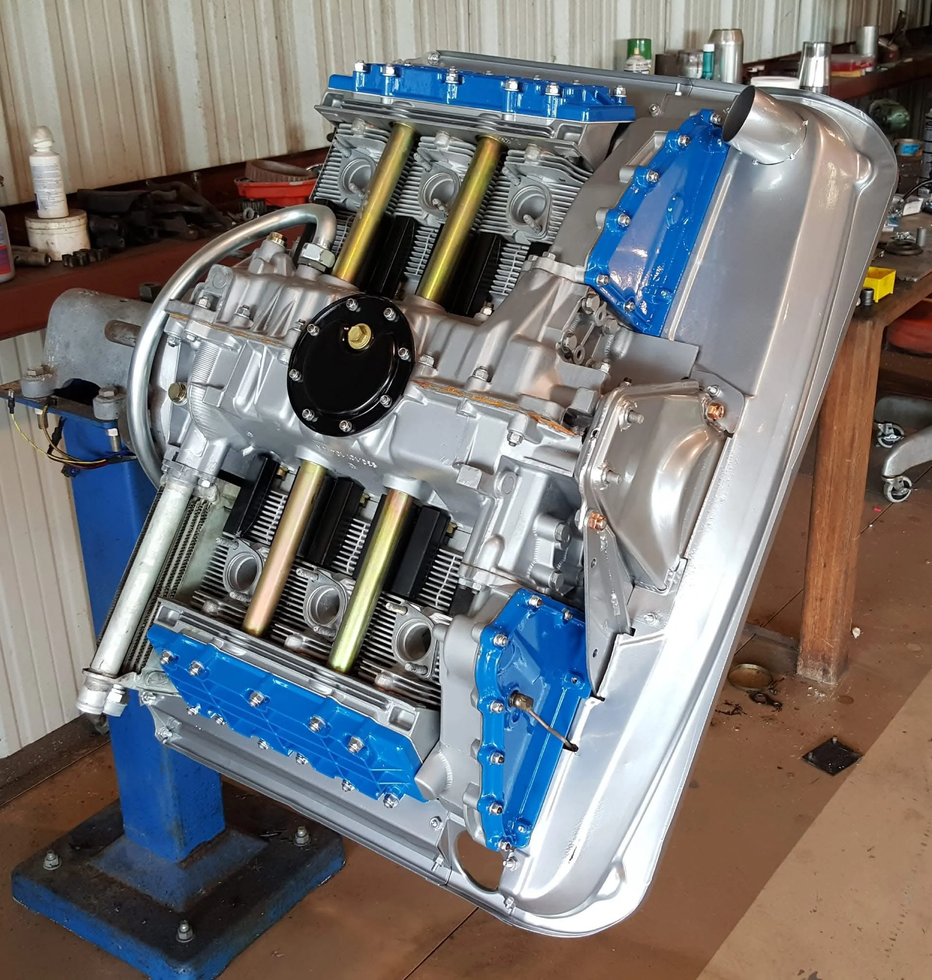 Radial engine on a stand in a workshop setting.