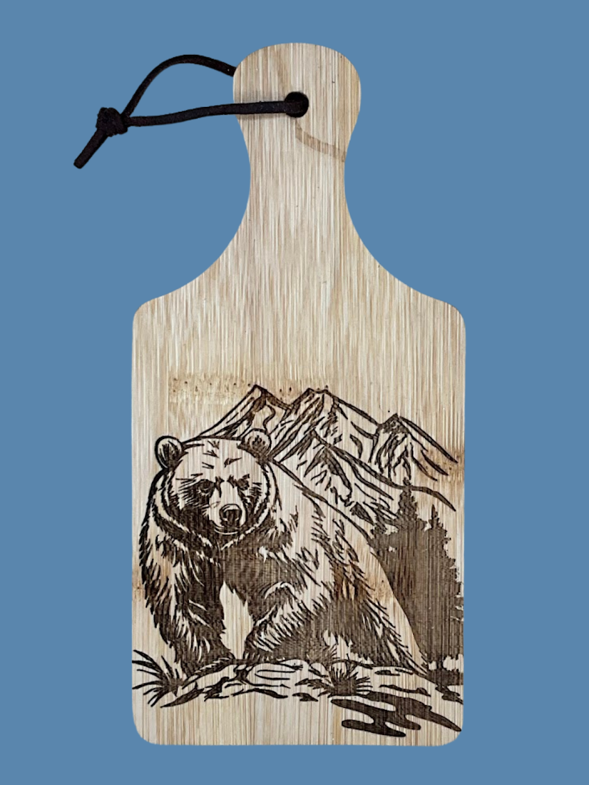 Bring a unique blend of nature and language to your kitchen with this handcrafted 5”x7” bamboo cutting board. Featuring a detailed laser-engraved design of a wolf forming the American Sign Languag.zip - 3.png