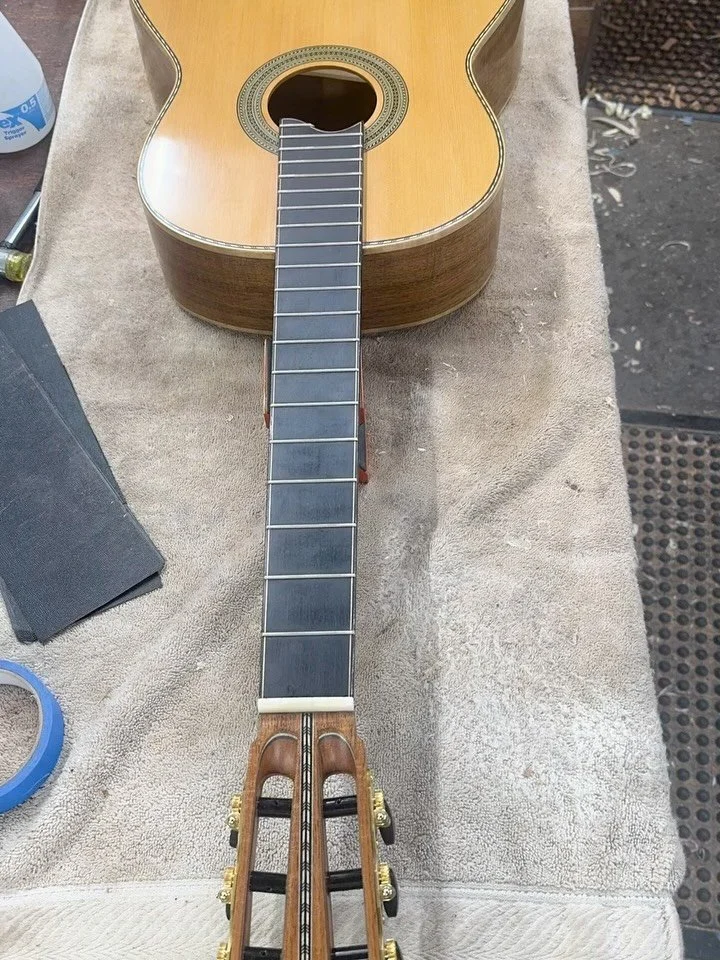 My latest classical is just about complete. It will make its first sounds after a string setup tomorrow. 

Today I buffed and polished the finish and also levelled, crowned and polished the frets. The first video is over 2.5hrs of fret leveling conde