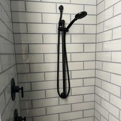 Custom shower plumbing installation with black fixtures by Gardner Plumbing Services in Wenatchee Washington