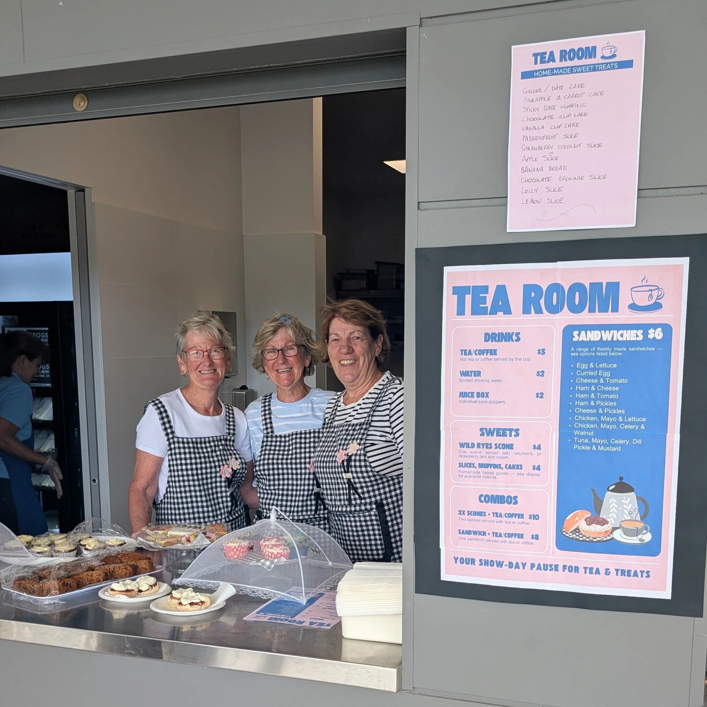 Tea room volunteers serving cakes and scones.