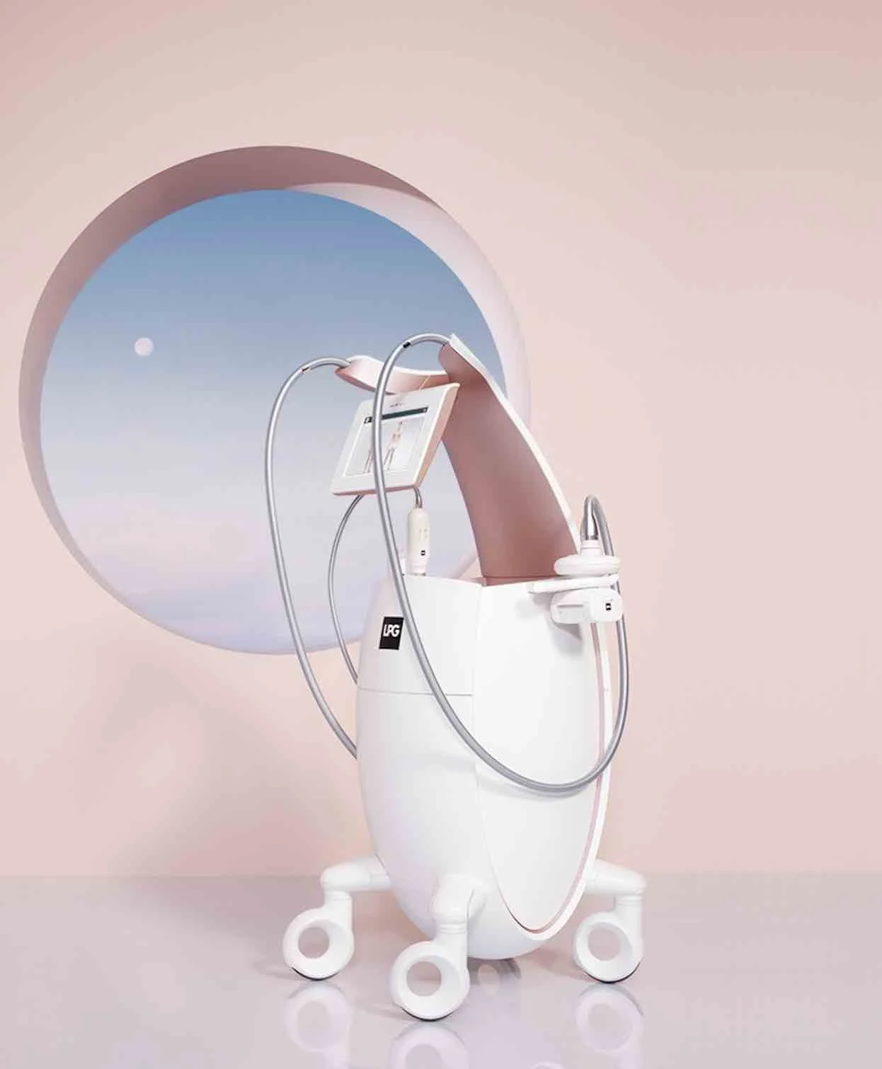 A modern, pink-colored electronic medical device with a tablet, tubes, and a tablet holder, designed for cosmetic or aesthetic treatments, positioned against a pastel pink wall with a window showing a blue sky and moon.