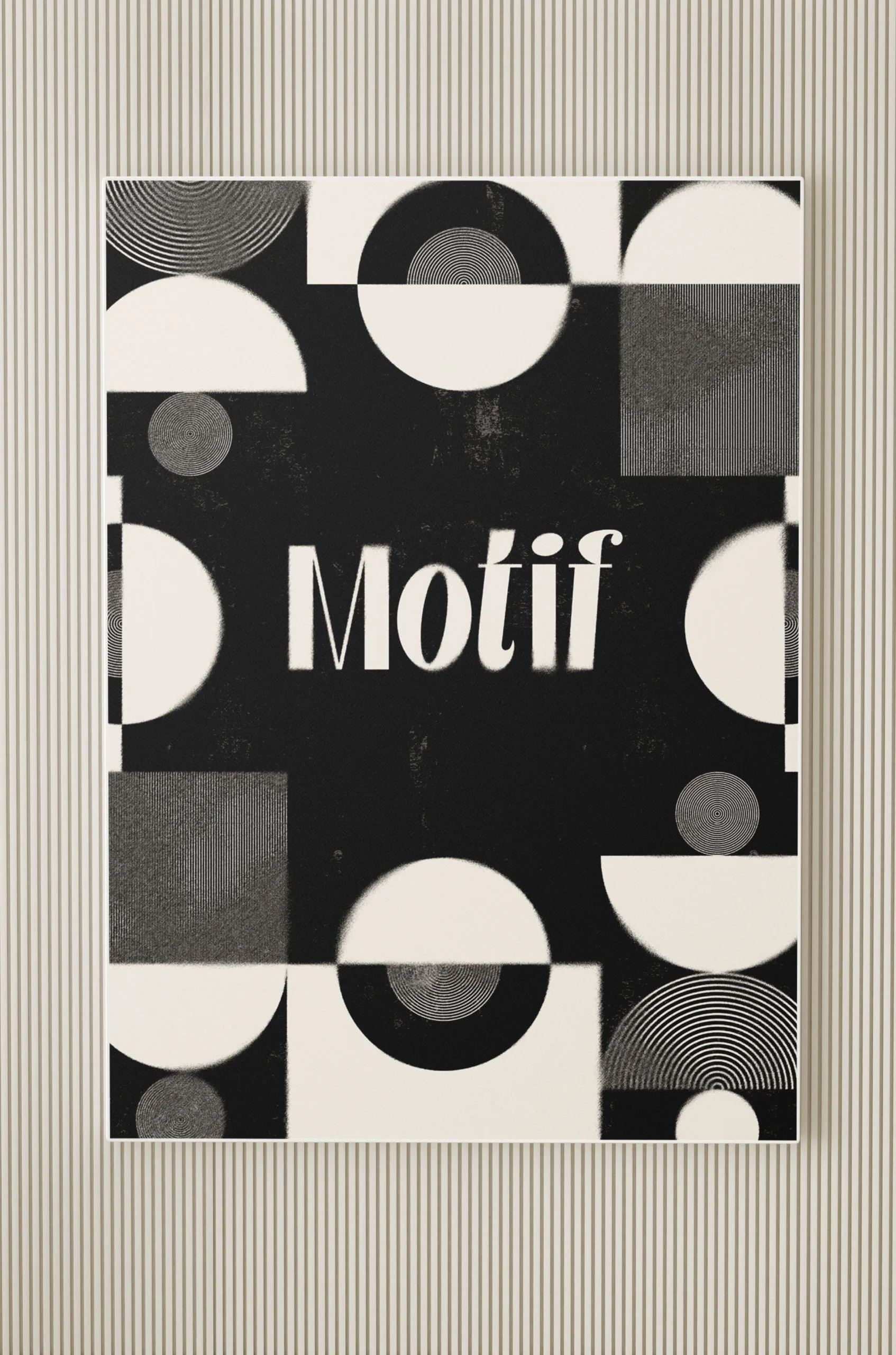 Poster frame on a wood panelled wall with an abstract black and white poster that features the Motif logo in the centre