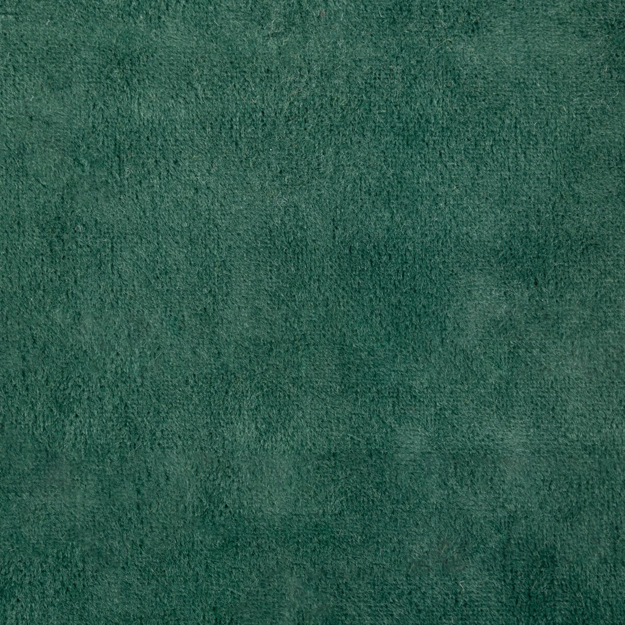 Close-up view of a green textured fabric surface.
