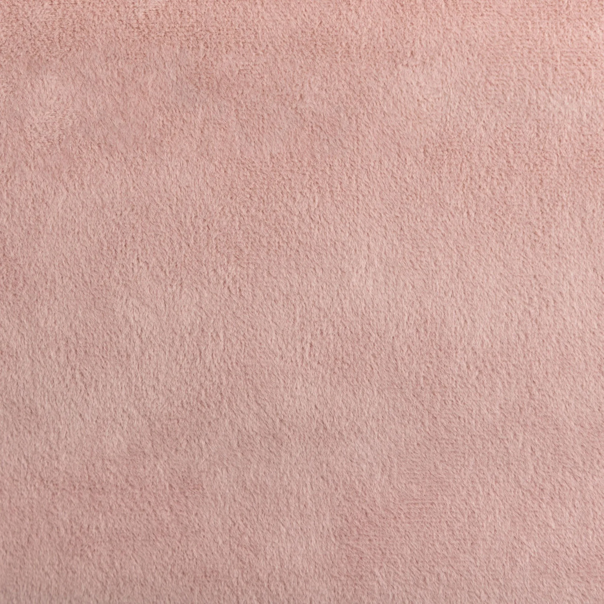 Close-up of a pink textured fabric, in velvet.