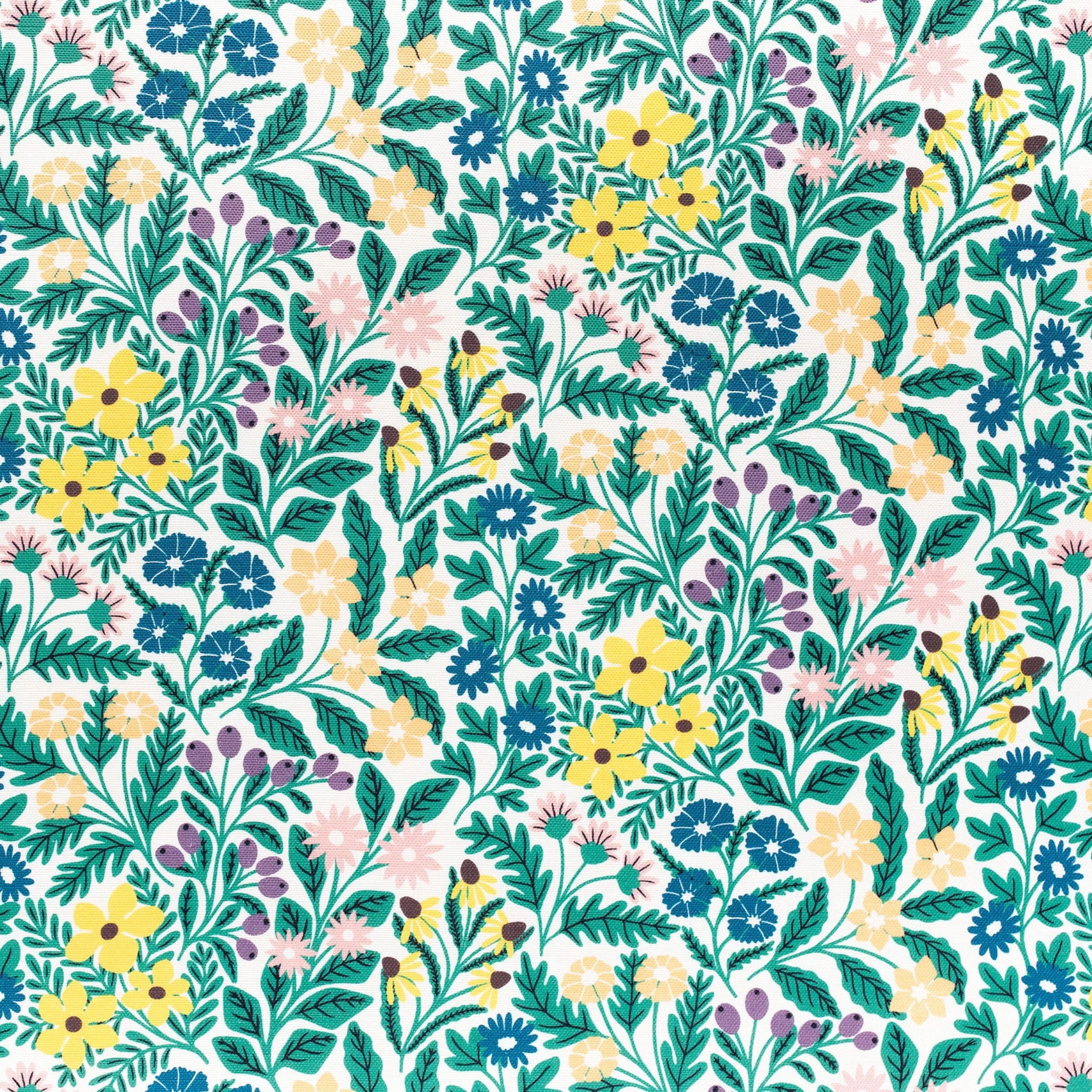 A colorful, floral-patterned fabric featuring yellow, pink, blue, and purple flowers with green leaves on a light background.