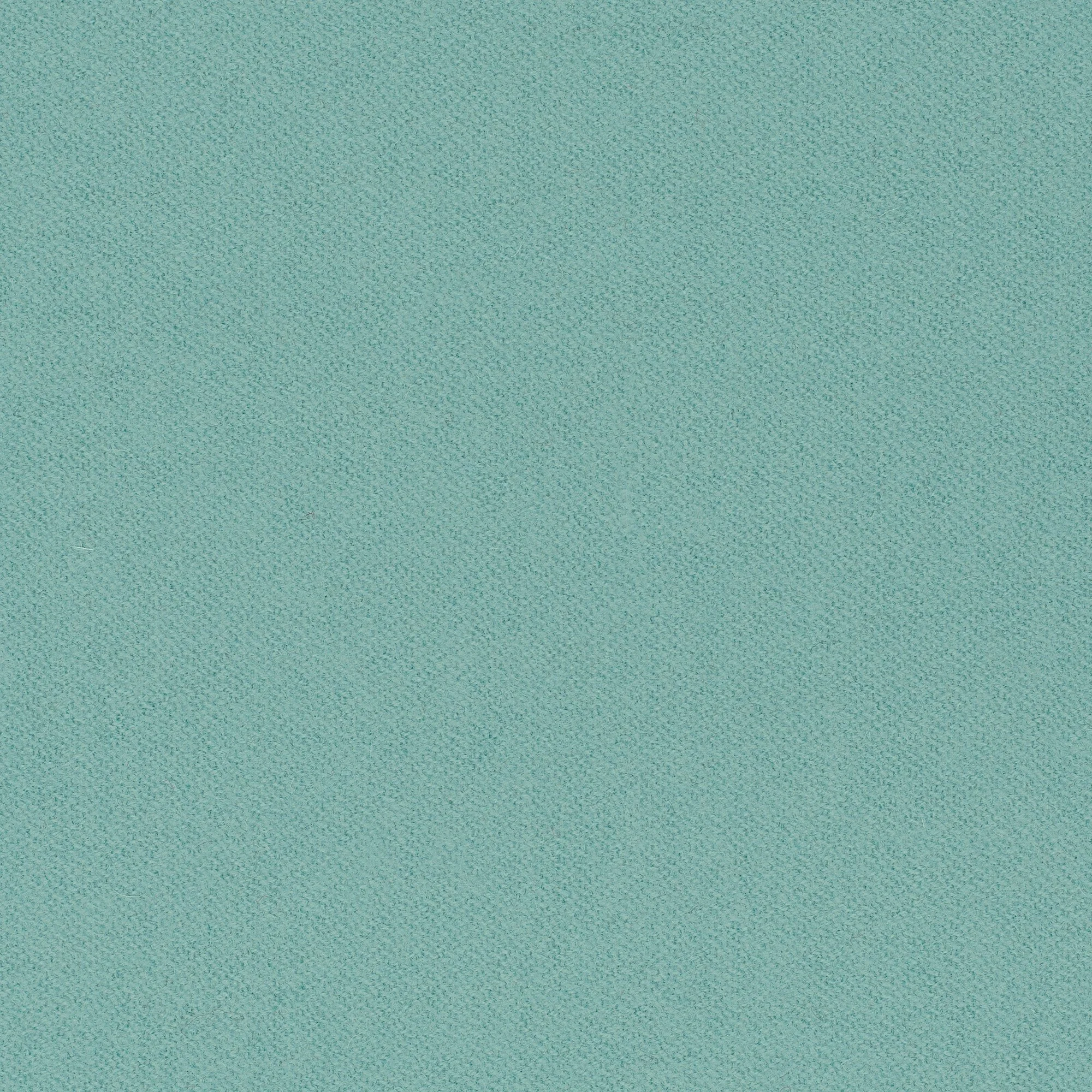 Close-up of a textured blue-green fabric.