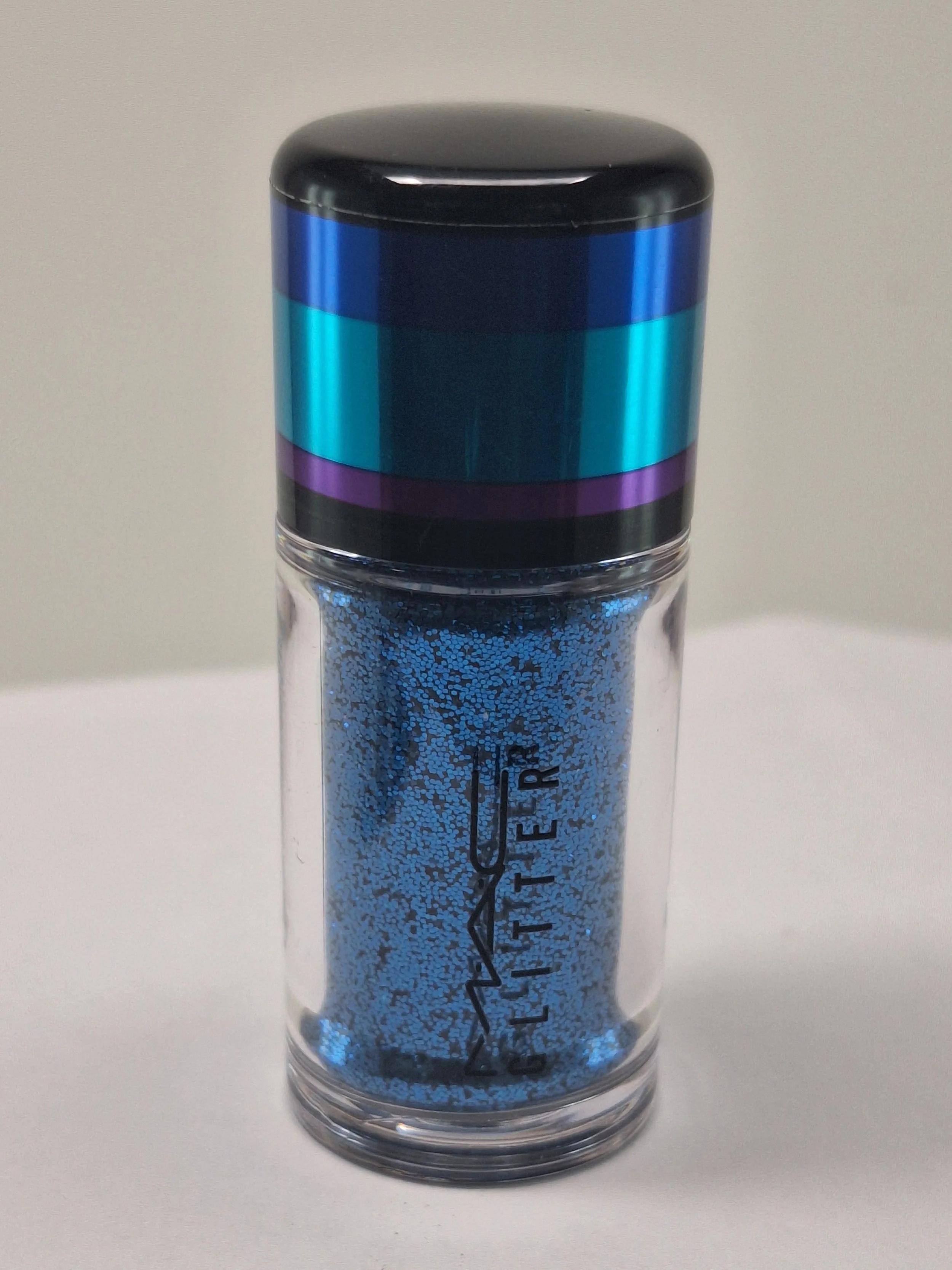 M·A·C Irresistibly Charming blue glitter pigment displayed in its original limited-edition holiday packaging from the 2015 collection.