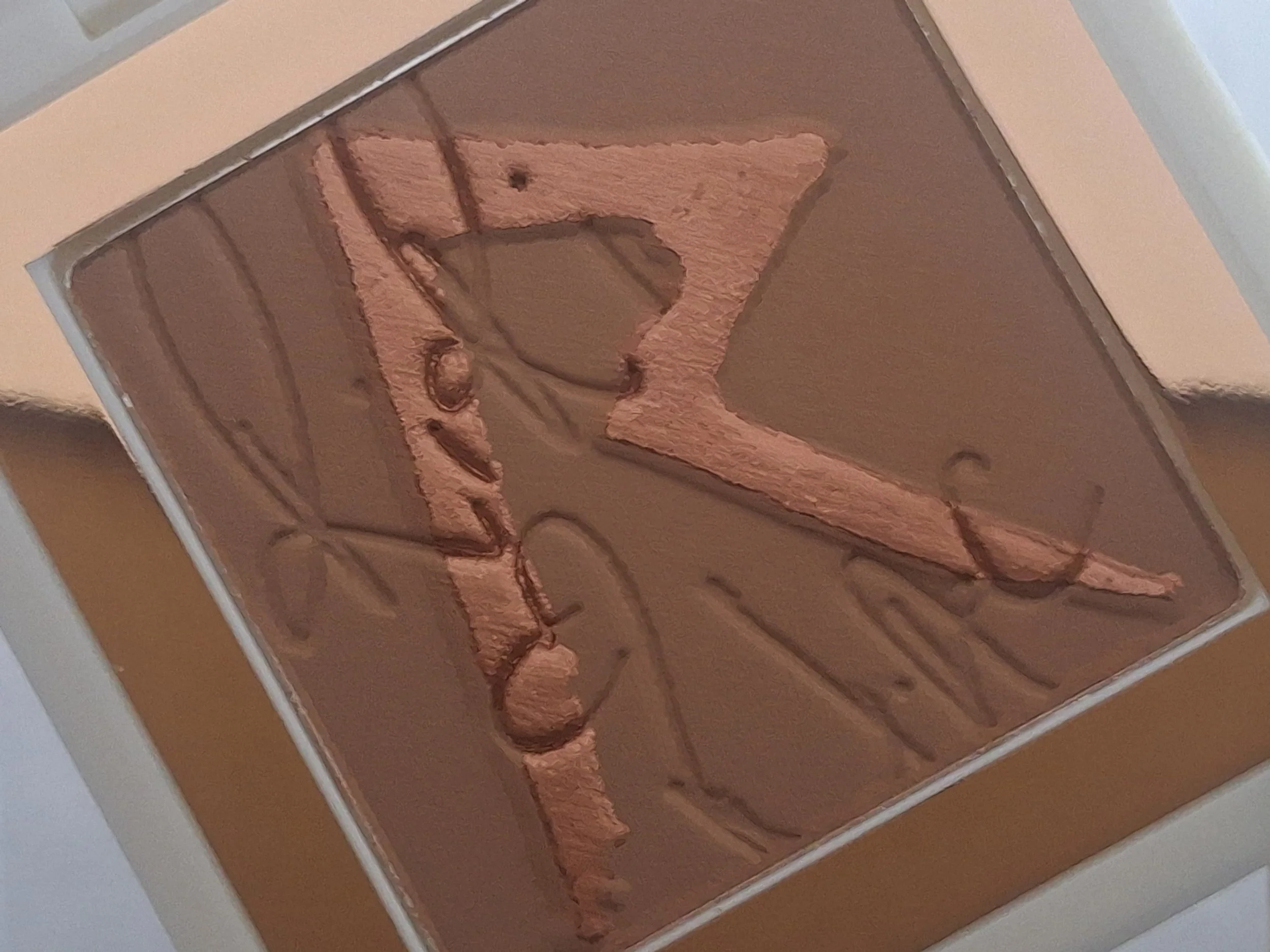 Close-up of M·A·C RiRi ♥ M·A·C lipsticks, blushes, bronzers, and store display board