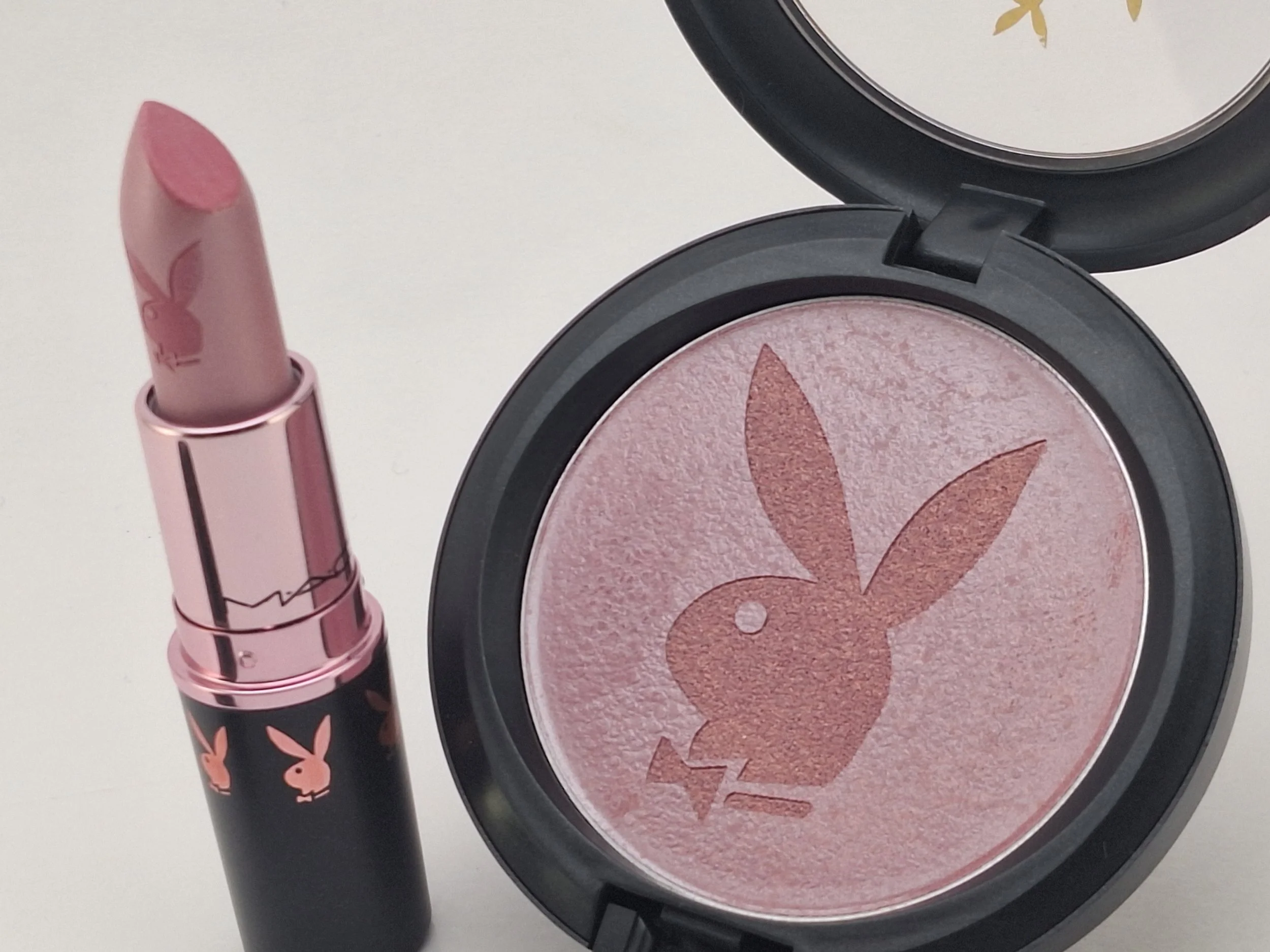 Close-up of rare M·A·C x Playboy Collection compact and lipstick with iconic bunny logo