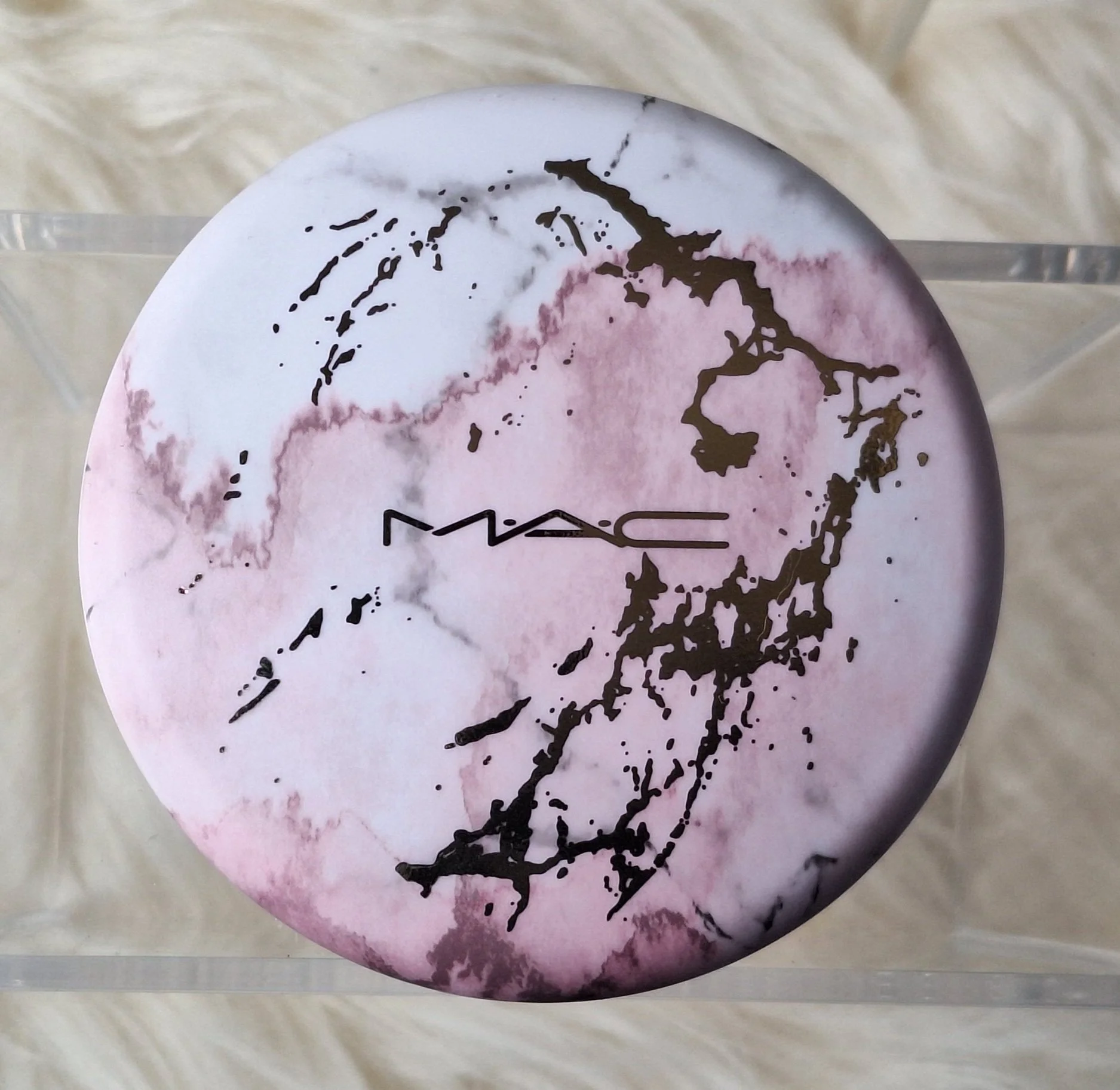 Marbled case M·A·C Electric Wonder bronzers, powders, and lipstick collector’s set."