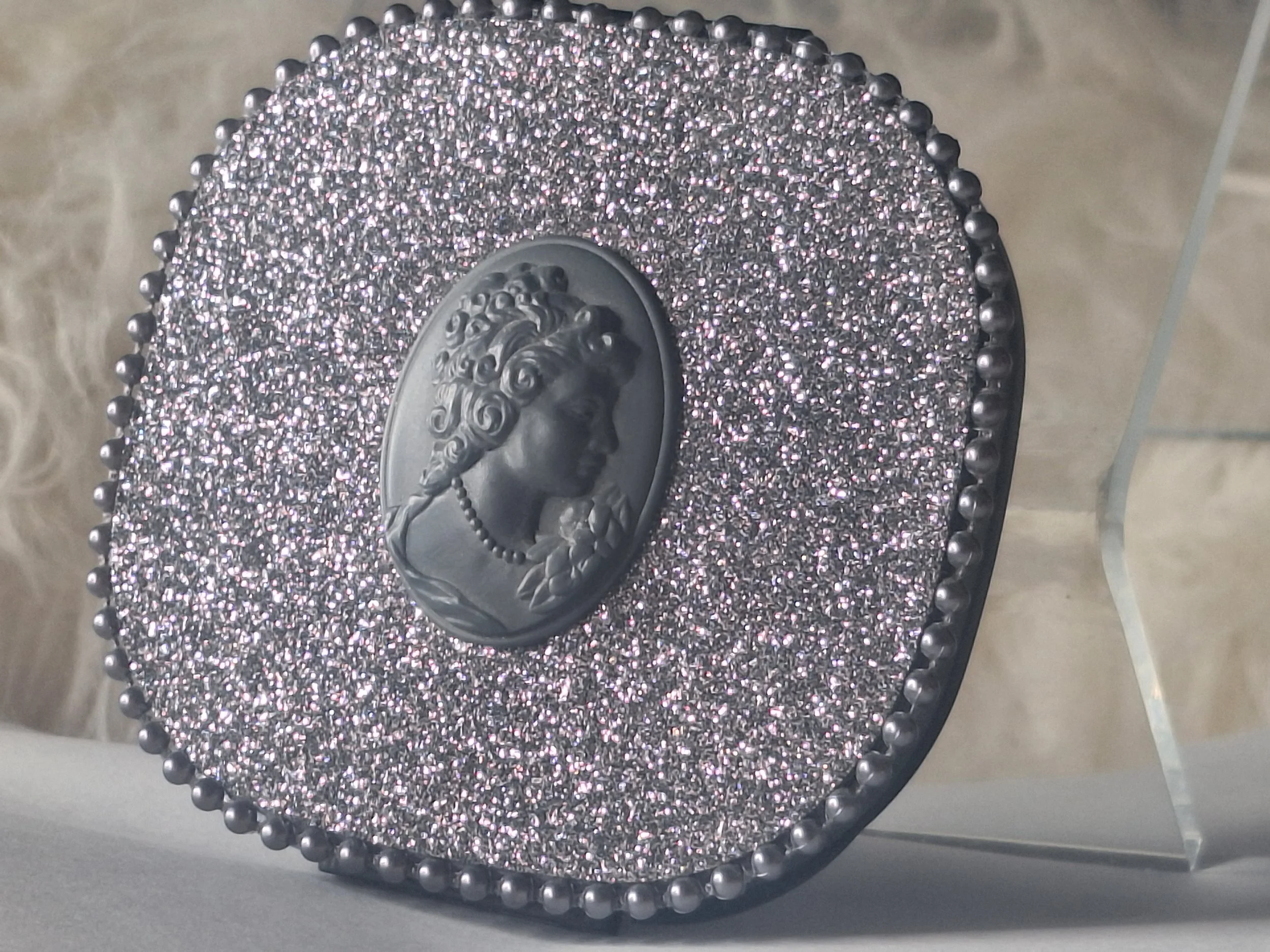 Close-up of cameo pearlized packaging from M·A·C Keepsakes Holiday 2014