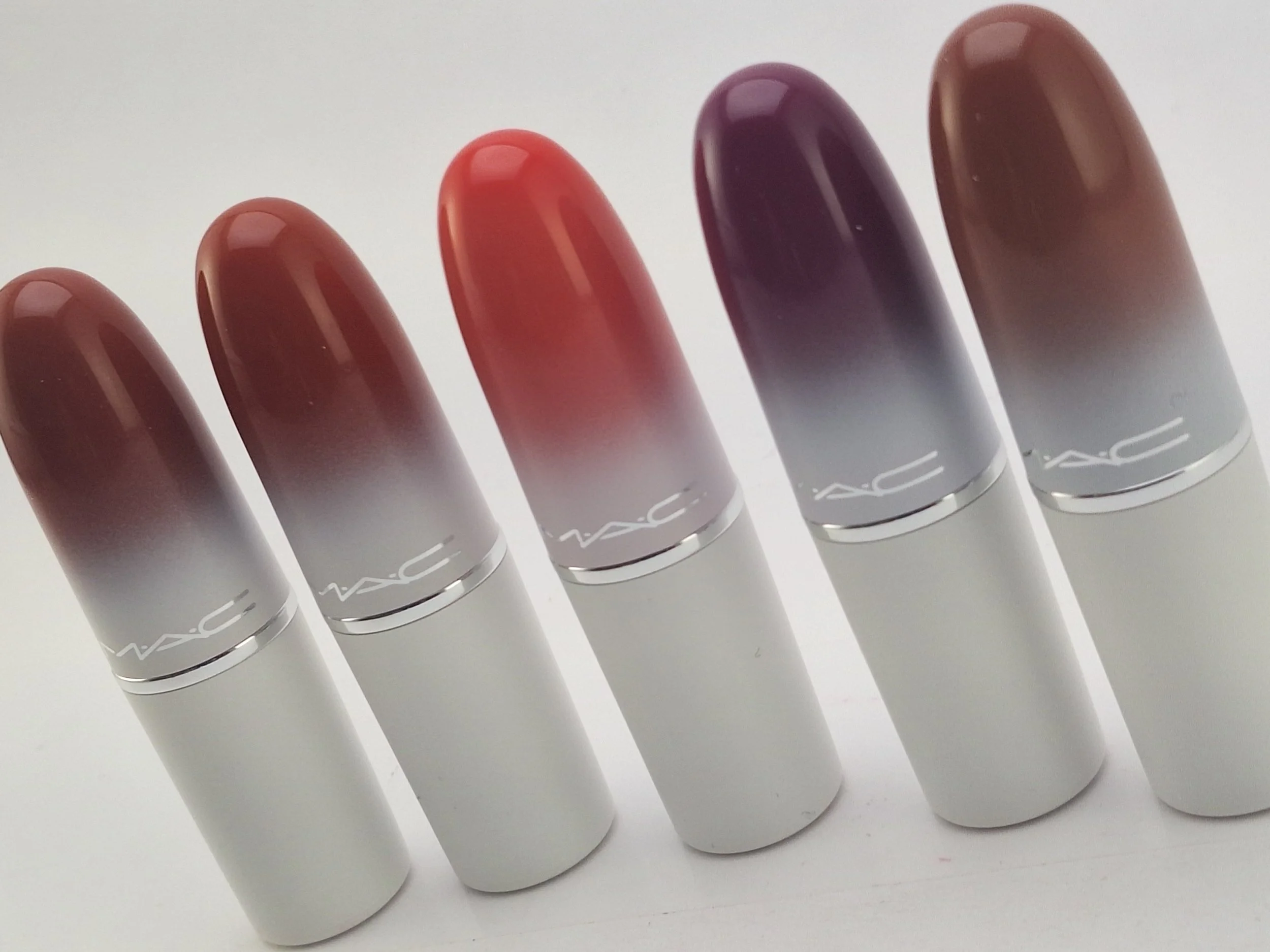 Five M·A·C lipsticks from the Bizarre Blizzard Bash Holiday 2023 collection displayed together in limited-edition winter-themed packaging.
