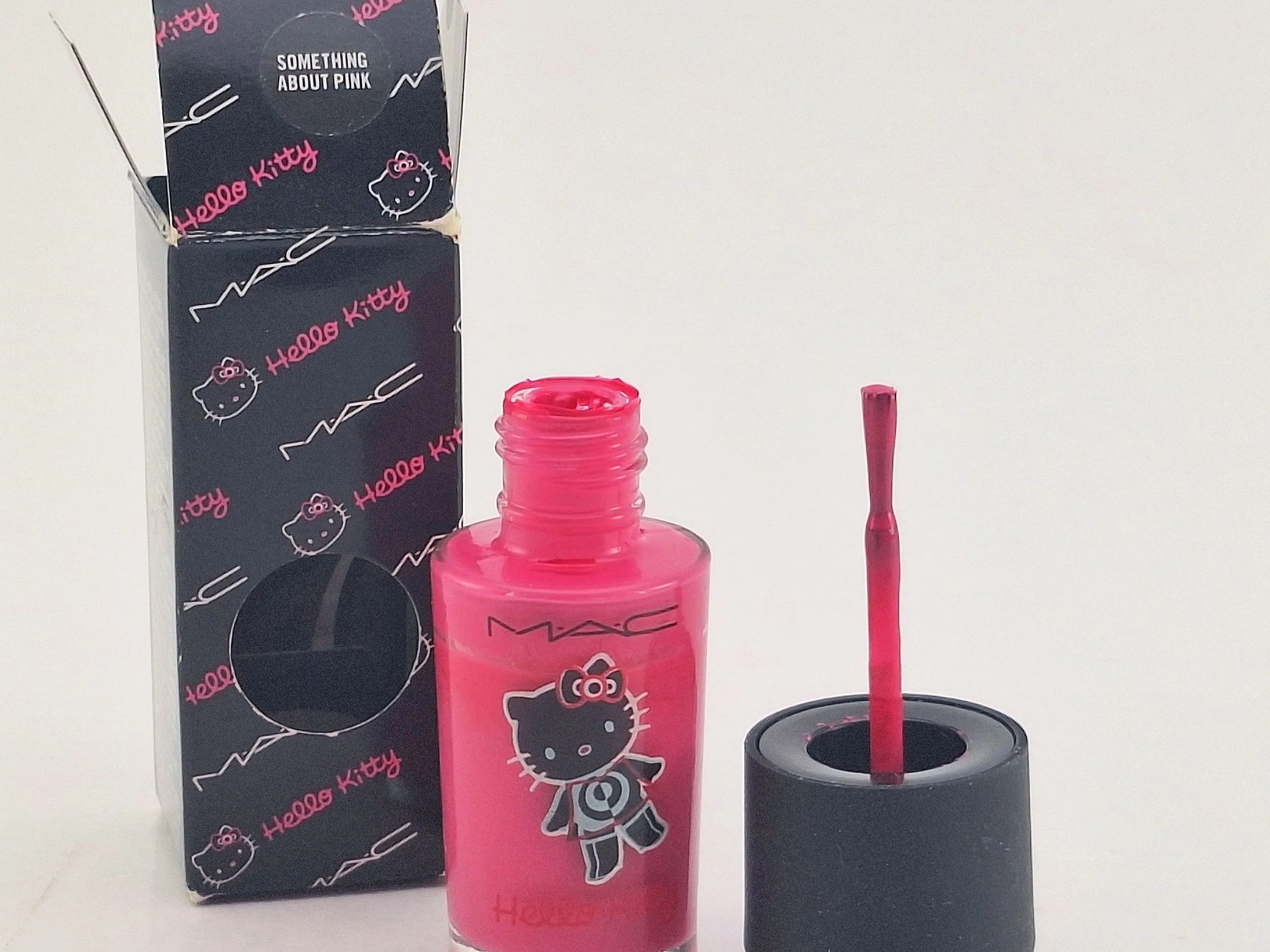 Hello Kitty nail polish displayed beside its original packaging from the limited-edition Hello Kitty beauty collection.