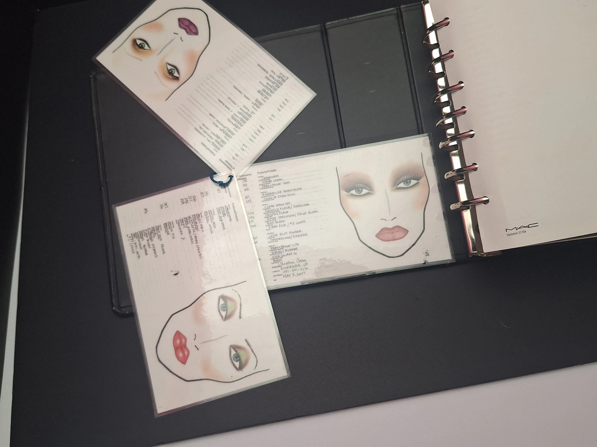"Private collection of MAC Cosmetics face charts including standard, Patrick Starrr, Marilyn Monroe, Technique, and laminated MAC Bible ring charts."