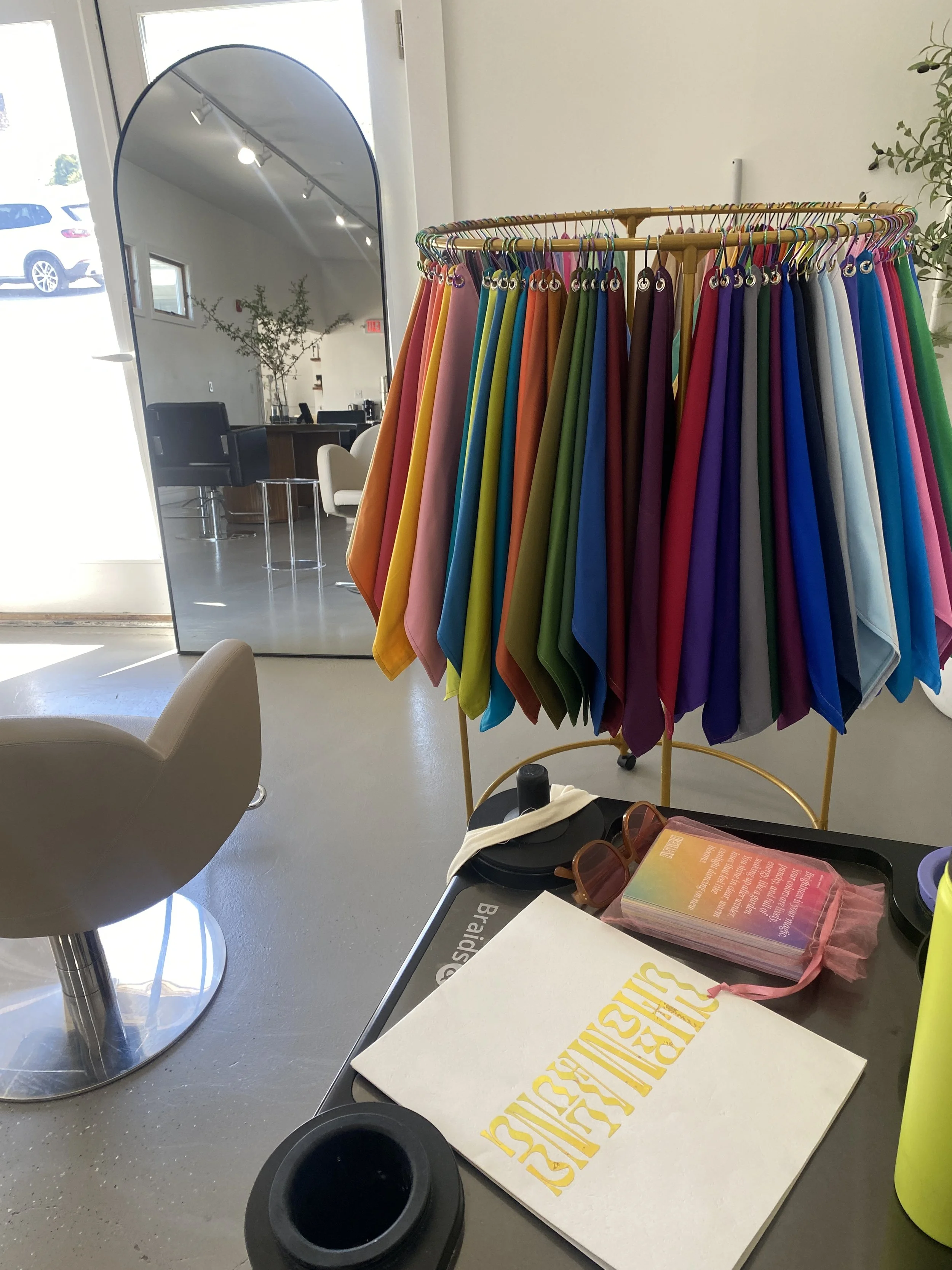 Beth from Chromalune's custom drapes for color analysis set up at ŌRA Beauty hair salon in Middletown Rhode Island 