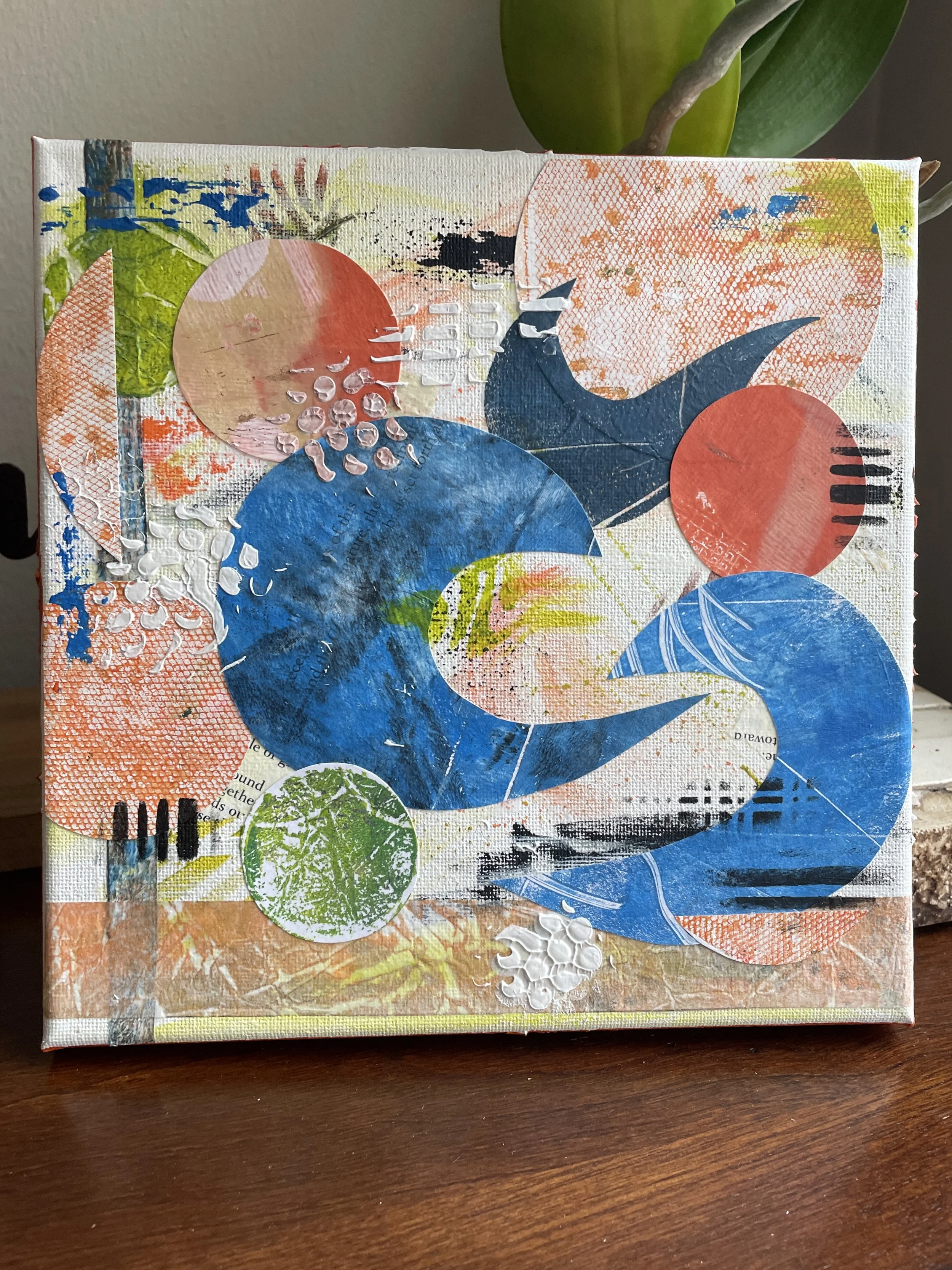 Blue and orange 8" square Collage on wrapped canvas; $175