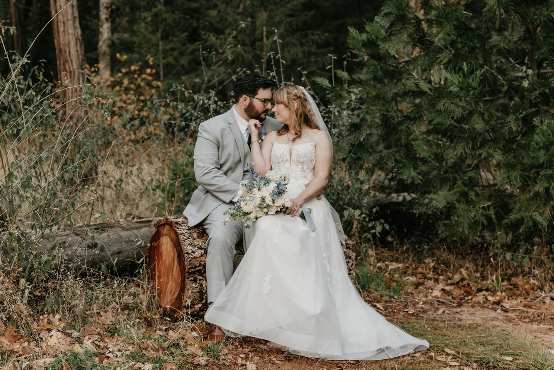 couple in Lake Tahoe national forest with bridal bouquet