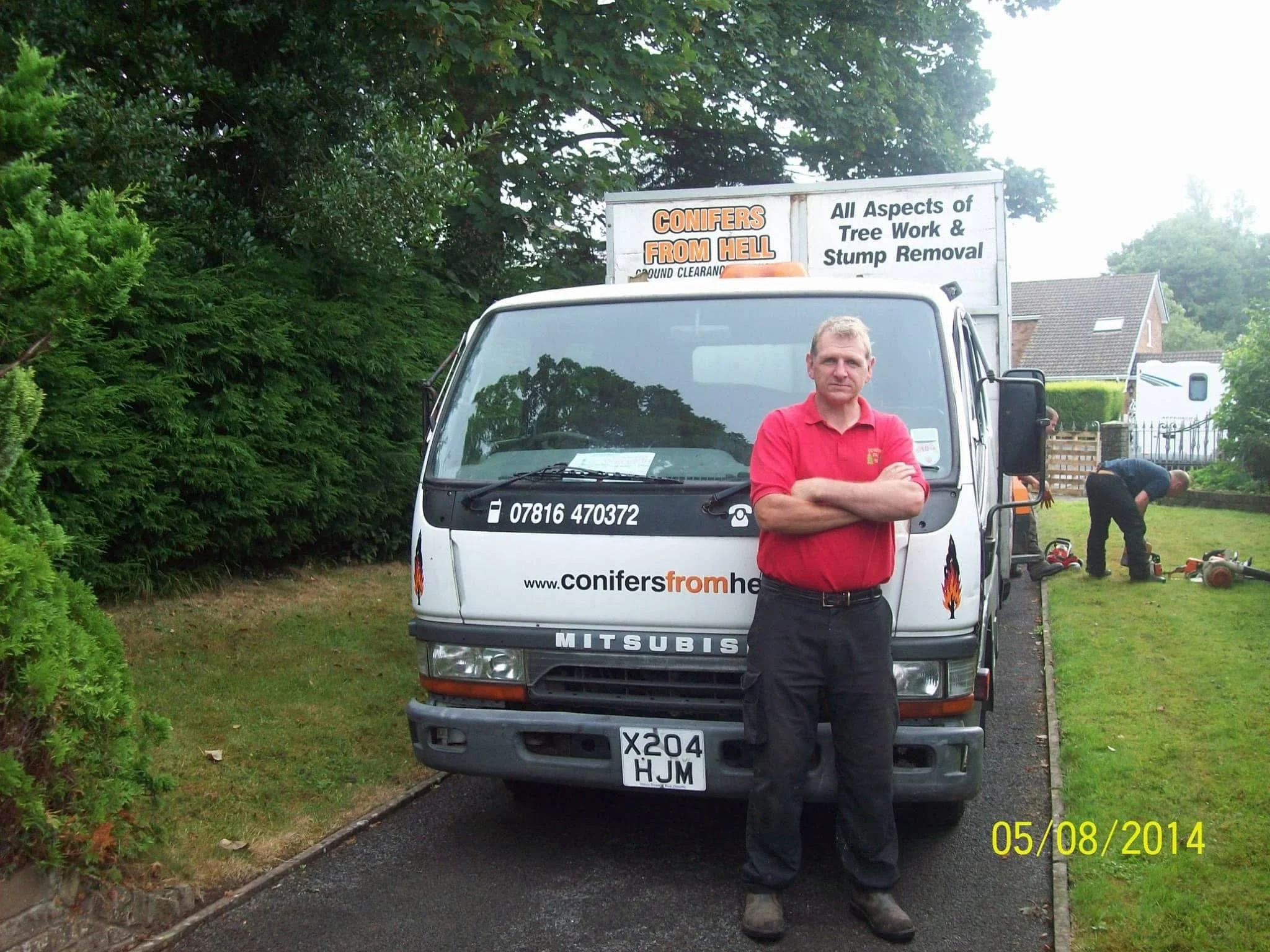 Mark Williams, founder of Conifers From Hell, carrying out tree work in Swansea