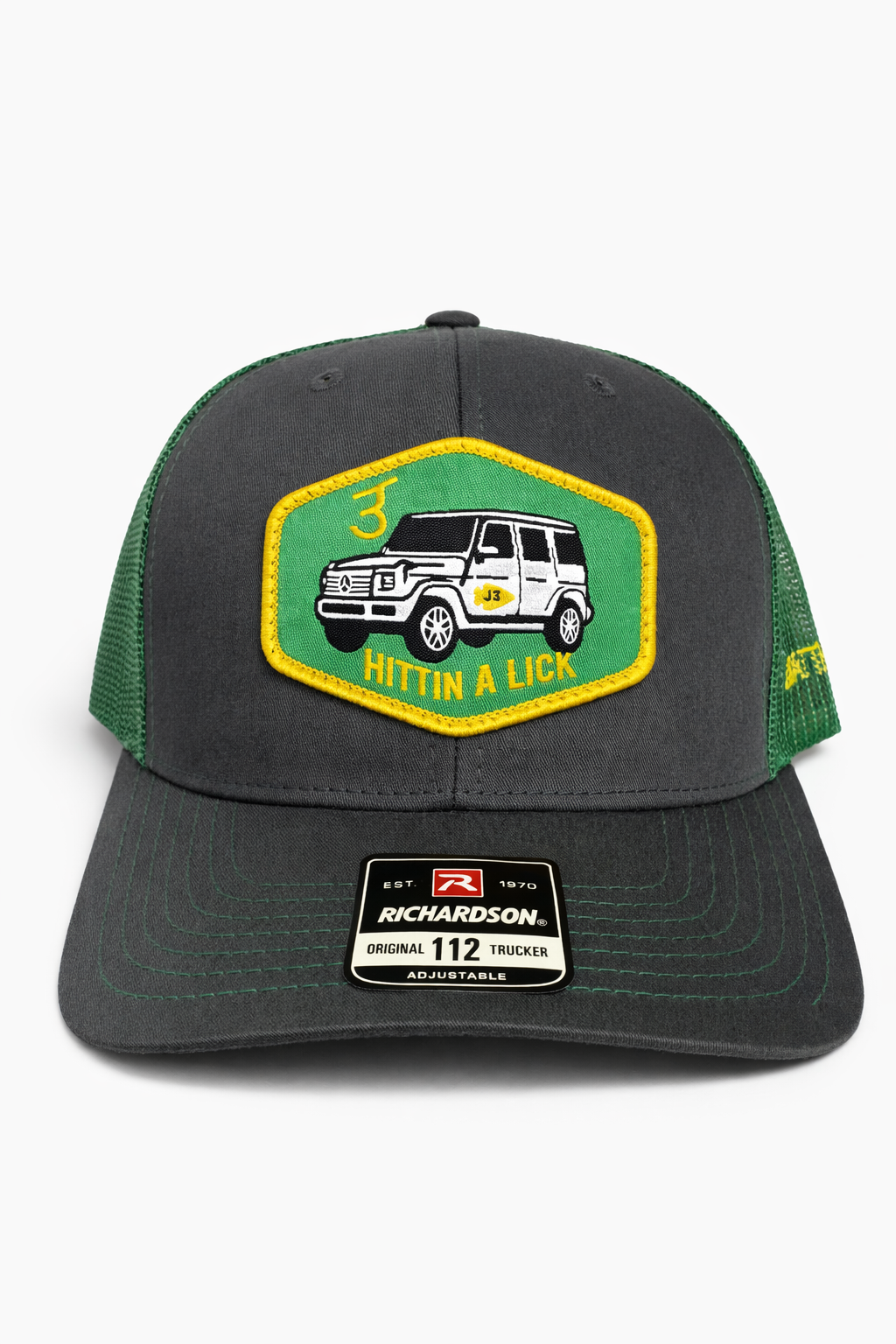 Trucker Hat in Charcoal and Green with “Hittin a Lick” G-Wagon Patch