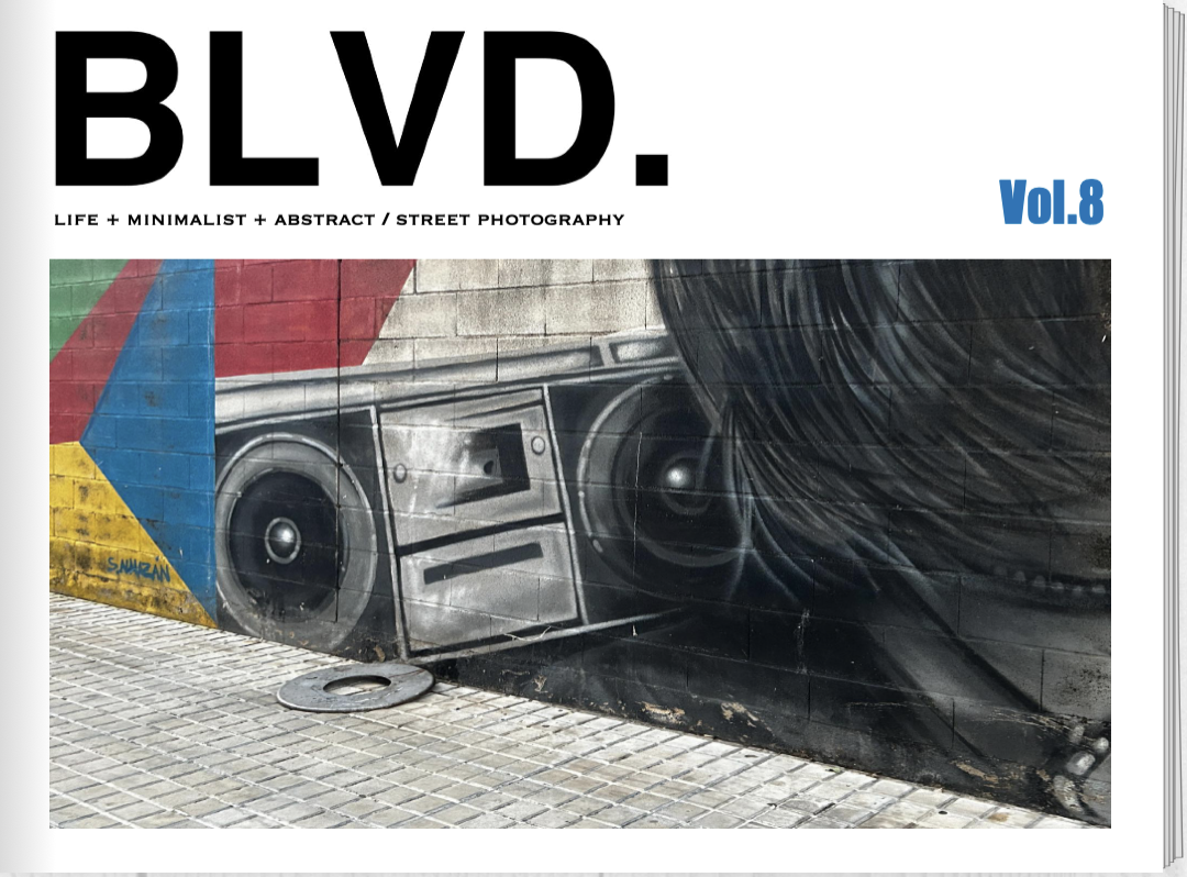 Street art graffiti of a vintage boombox on a brick wall, with colorful geometric shapes in the background, part of a magazine cover titled 'BLVD.' with a subtitle 'Life + Minimalist + Abstract / Street Photography' and labeled 'Vol. 8'.