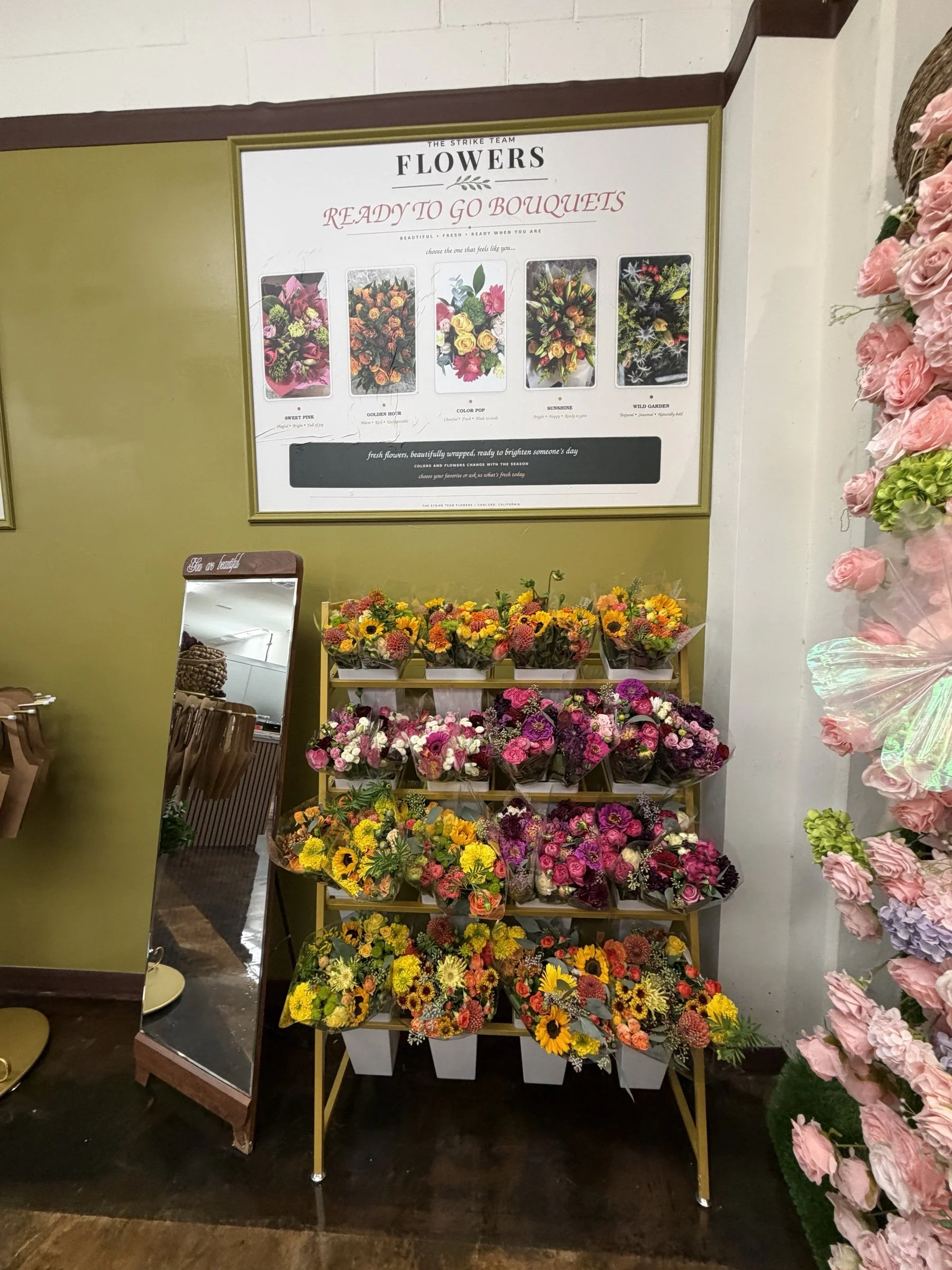 Ready-to-go bouquets displayed in the Concord shop at The Strike Team Flowers.